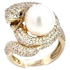 14K Yellow Gold Diamond Snake Ring Holding A Pearl