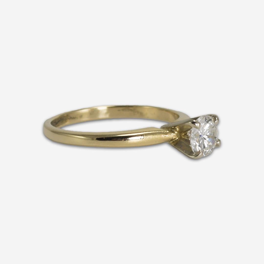 Diamond engagement ring in Tiffany-style setting.
Marked 14k and weighs 2.3 grams.
The round brilliant cut diamond is .57 carats, g color, and si2 clarity.
The ring size is 6 1/2 and can be sized to fit. 
Excellent condition!