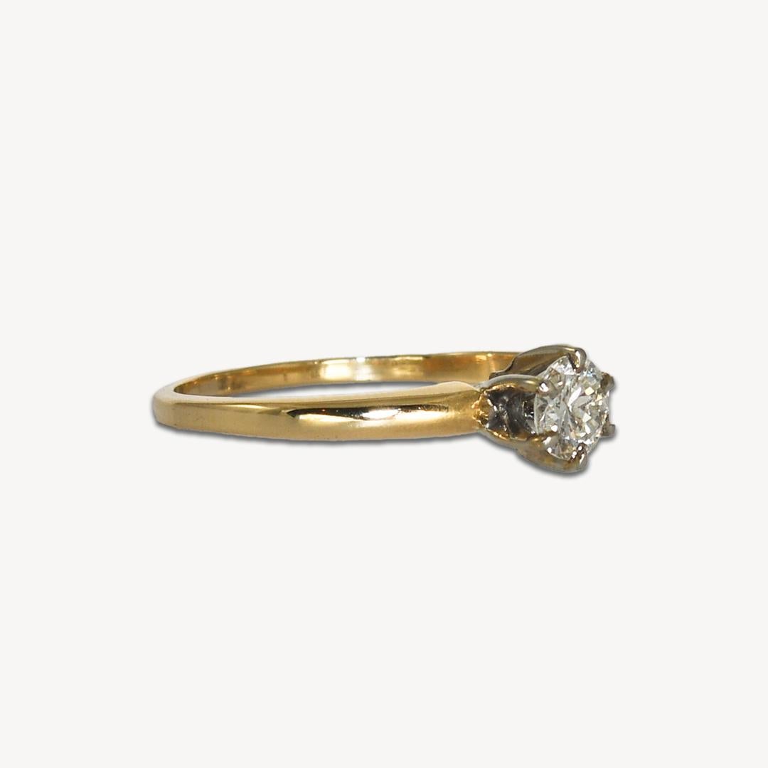 This gorgeous, solitaire-style 14-karat yellow gold ring weighs 1.85 grams. 
It contains one solitaire 3.5mm round brilliant diamond, with a total carat weight of 0.35. 
The diamond has a clarity of VS to SI. 
The ring is a size 7.5 and in excellent