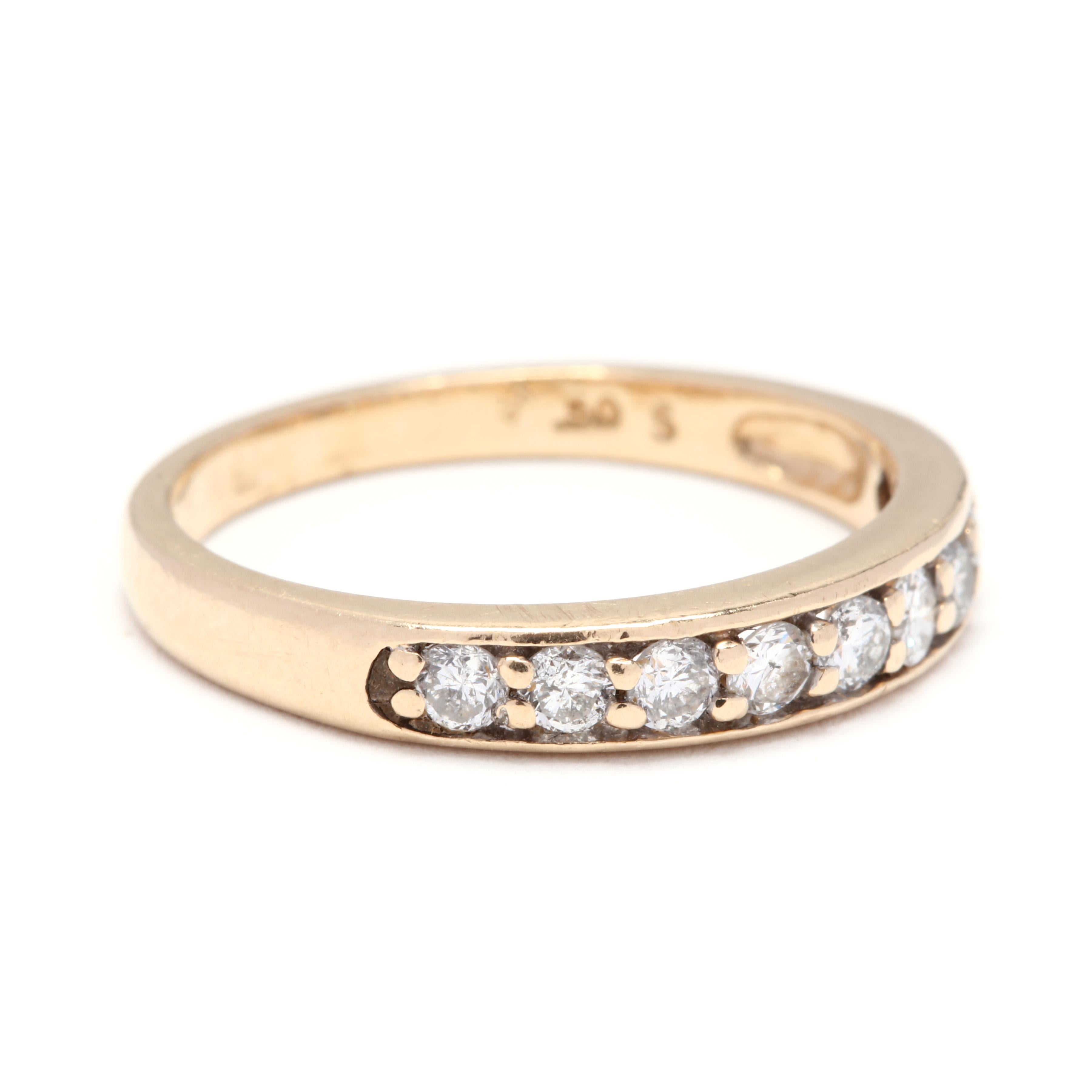A 14 karat yellow gold and diamond stackable wedding band ring. This ring features a tapered design set with full cut round diamonds weighing approximately .54 total carats.

Stones:
- diamonds, 9 stones
- full cut round
- 2 - 2.5 mm
- approximately