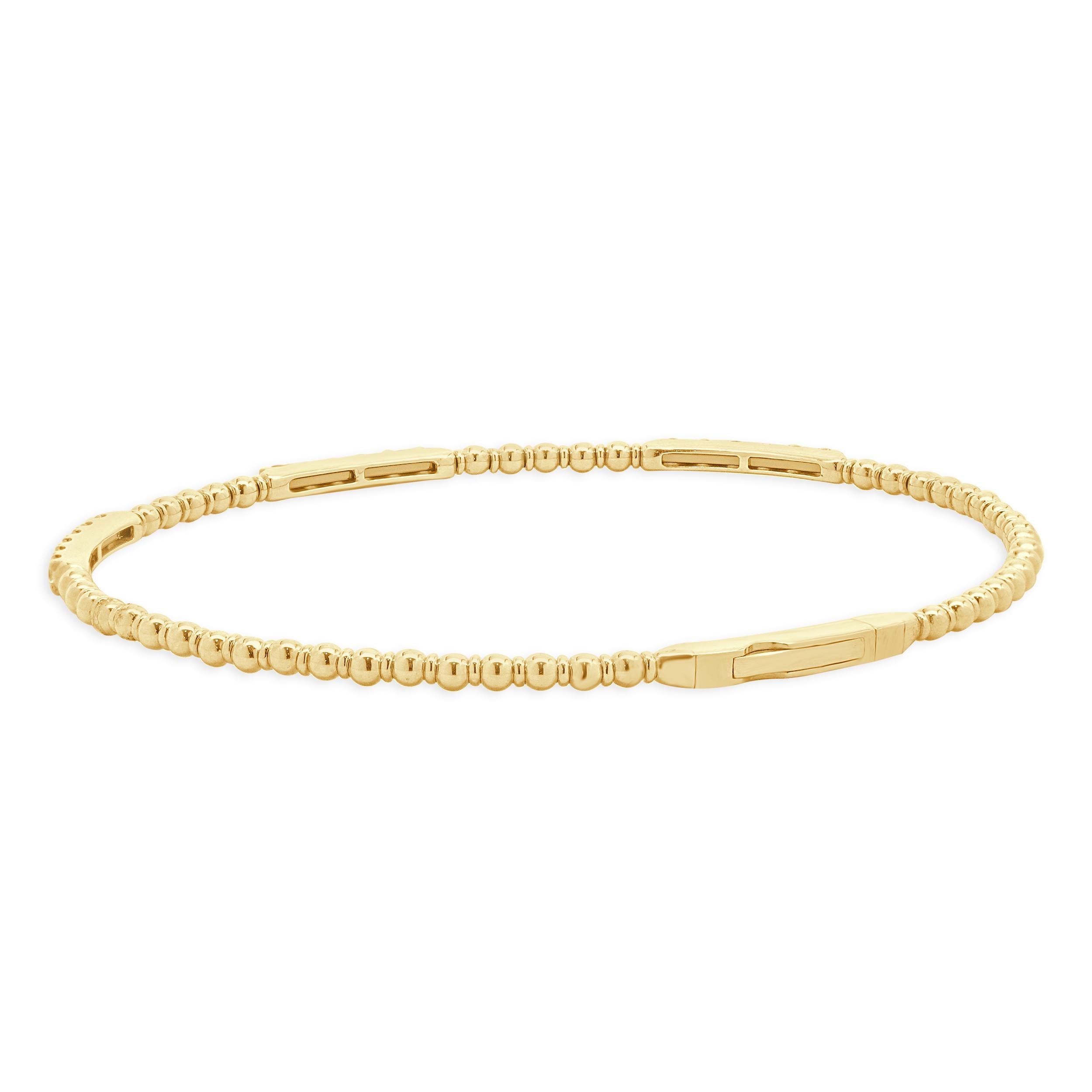 Designer: custom design
Material: 14K yellow gold
Diamond: round brilliant cut = 0.46cttw
Color: G
Clarity: SI1
Dimensions: bracelet will fit up to a 6.5-inch wrist
Weight: 5.59 grams
