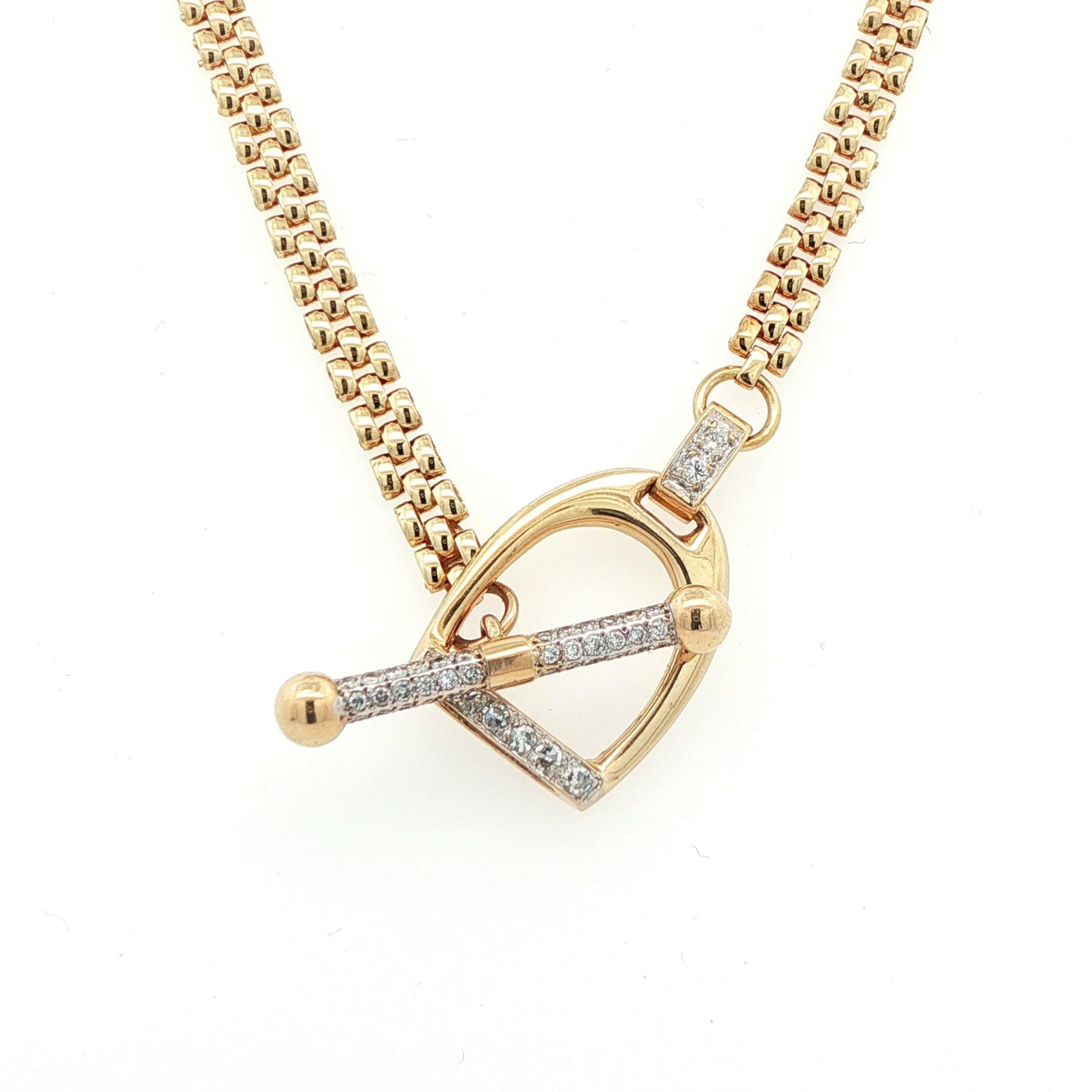 This incredible necklace is made in 14k yellow gold with several bight white diamonds and uses the horse stirrup as a toggle clasp. This design is fun, playful, and perfectly fits this style necklace and helps ensure the chain is always laying flat