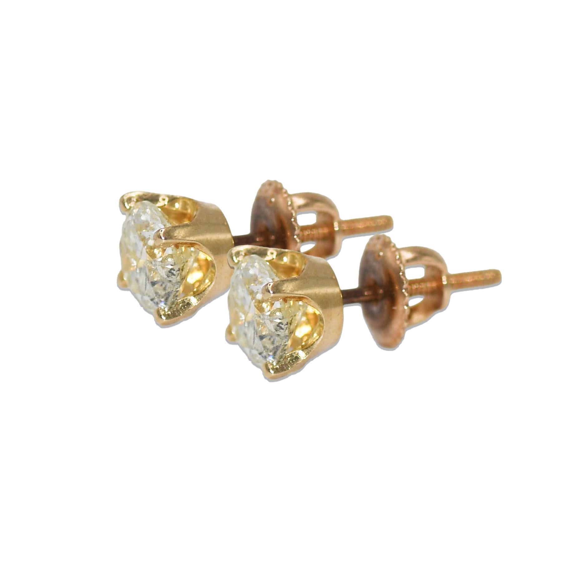 14k Yellow Gold Diamond Studs.
Stamped 585
Round Brilliant cuts, 1.50 total carats, K-L-M Color, I1-I2 Clarity.
weighs 1.6 grams gross weight.
Screw backs for pierced ears.
Both stones face up very nice.

