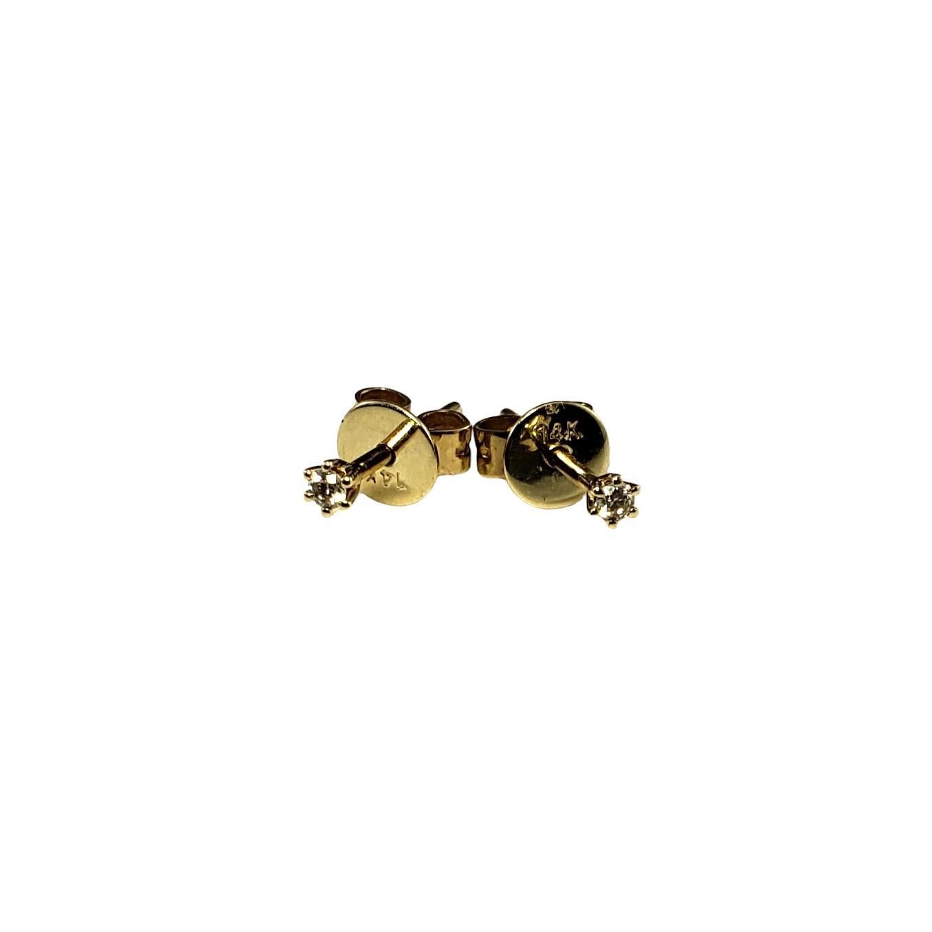 14K Yellow Gold Diamond Stud Earrings-

These sparkling stud earrings each feature one round brilliant cut diamond set in classic 14K yellow gold.  Push back closures.

Approximate total diamond weight: .04 ct.

Diamond color: J

Diamond clarity: