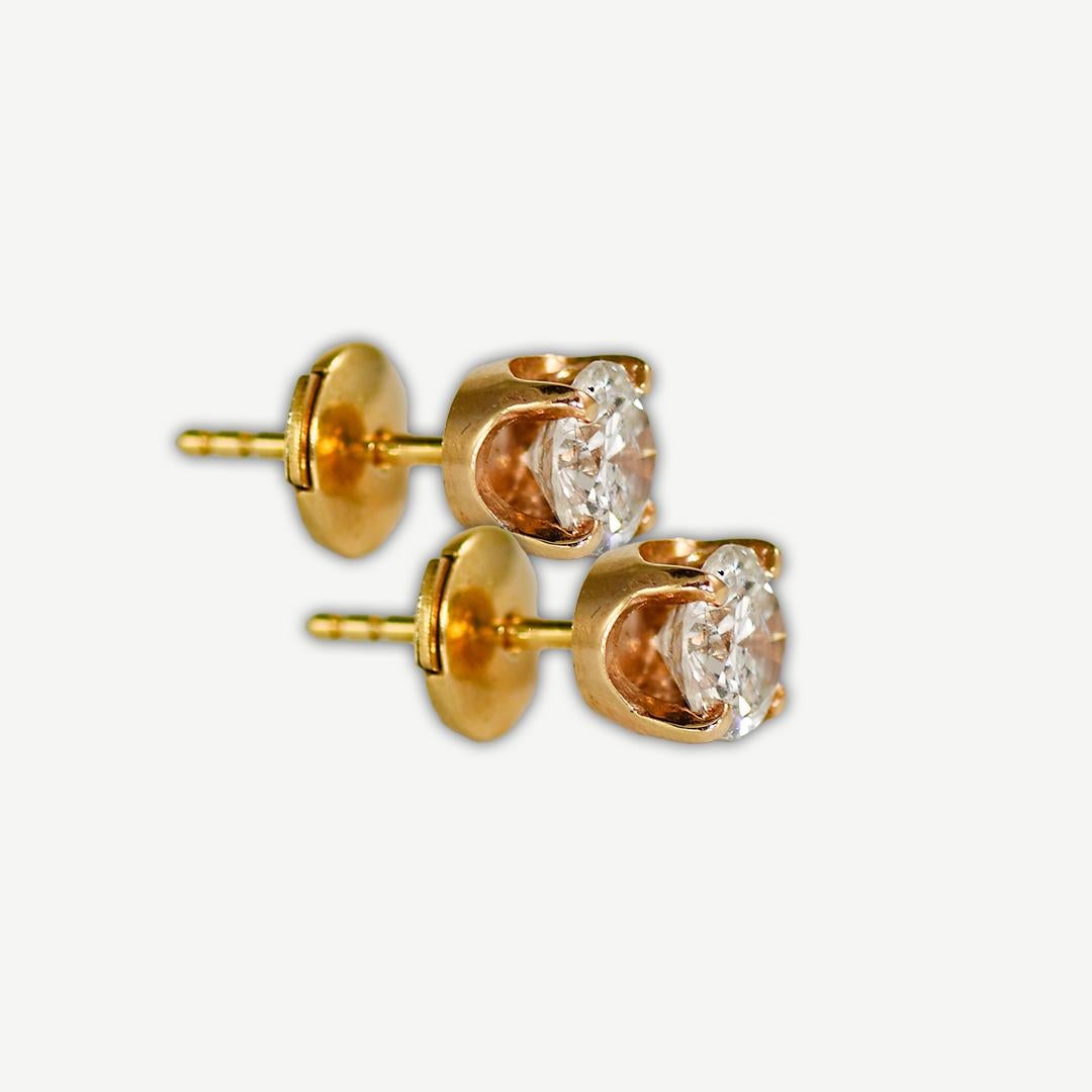 Diamond stud earrings set in 14k yellow gold mountings.
The diamonds are round brilliant cuts, h color, si clarity, 1.20 carats total weight.
Very nice symmetry and brilliance.
La Pousette Backings.