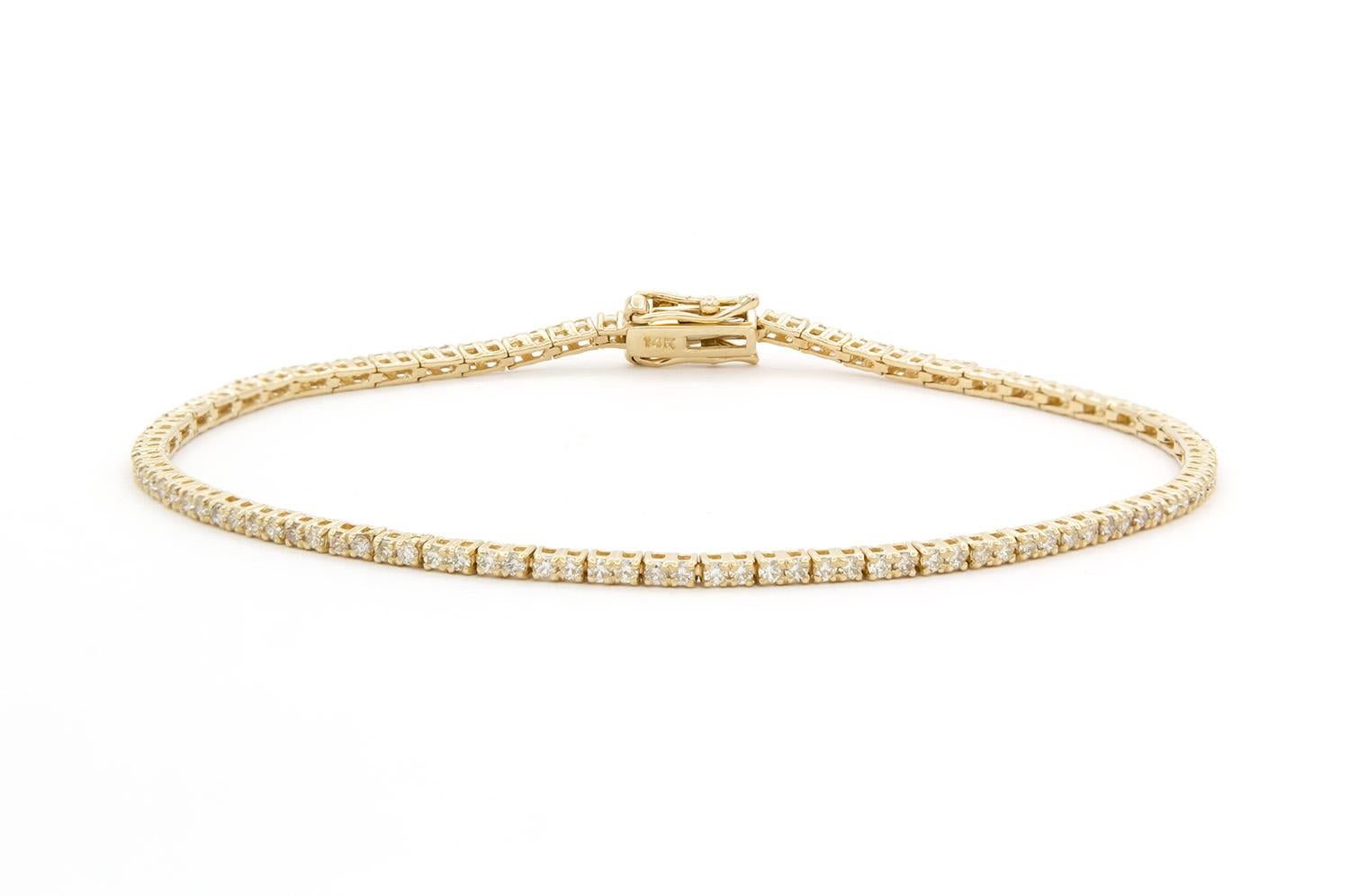 We are  pleased to present this beautiful Brand New 14k Yellow Gold & Diamond Tennis Bracelet. It features 1.15ctw G-H/VS2-SI1 Round Brilliant Cut Diamonds set in this 14k yellow gold tennis bracelet. The bracelet measures 7″ long and features a