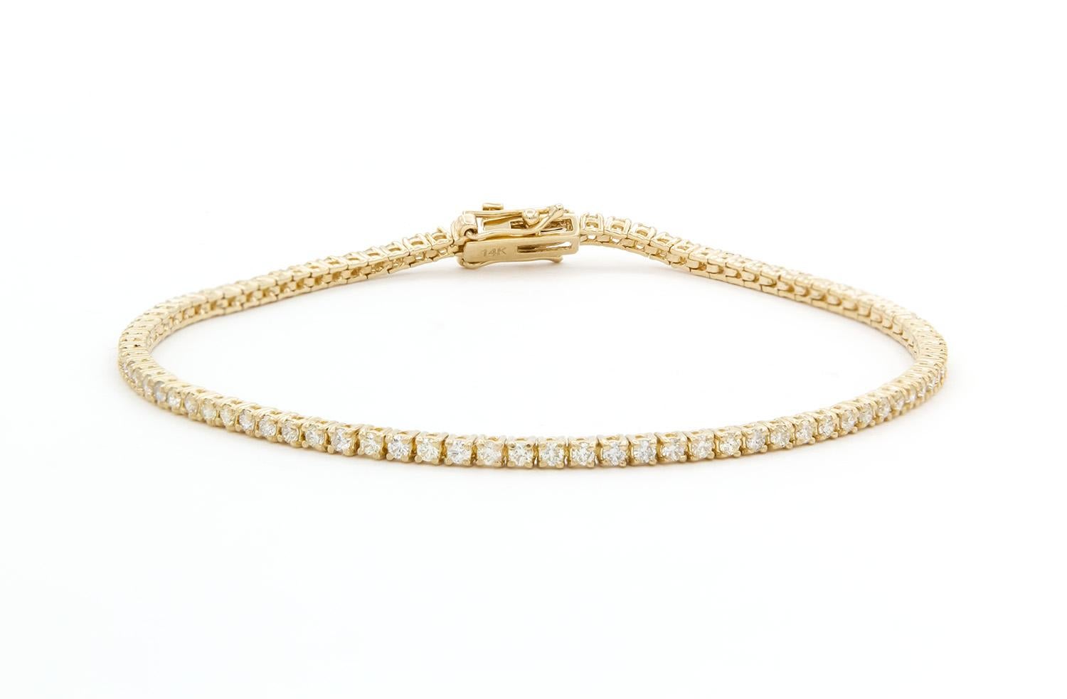 We are pleased to present this beautiful Brand New 14k Yellow Gold & Diamond Tennis Bracelet. It features 1.39ctw G-H/VS2-SI1 Round Brilliant Cut Diamonds set in this 14k yellow gold tennis bracelet. The bracelet measures 7″ long and features a push