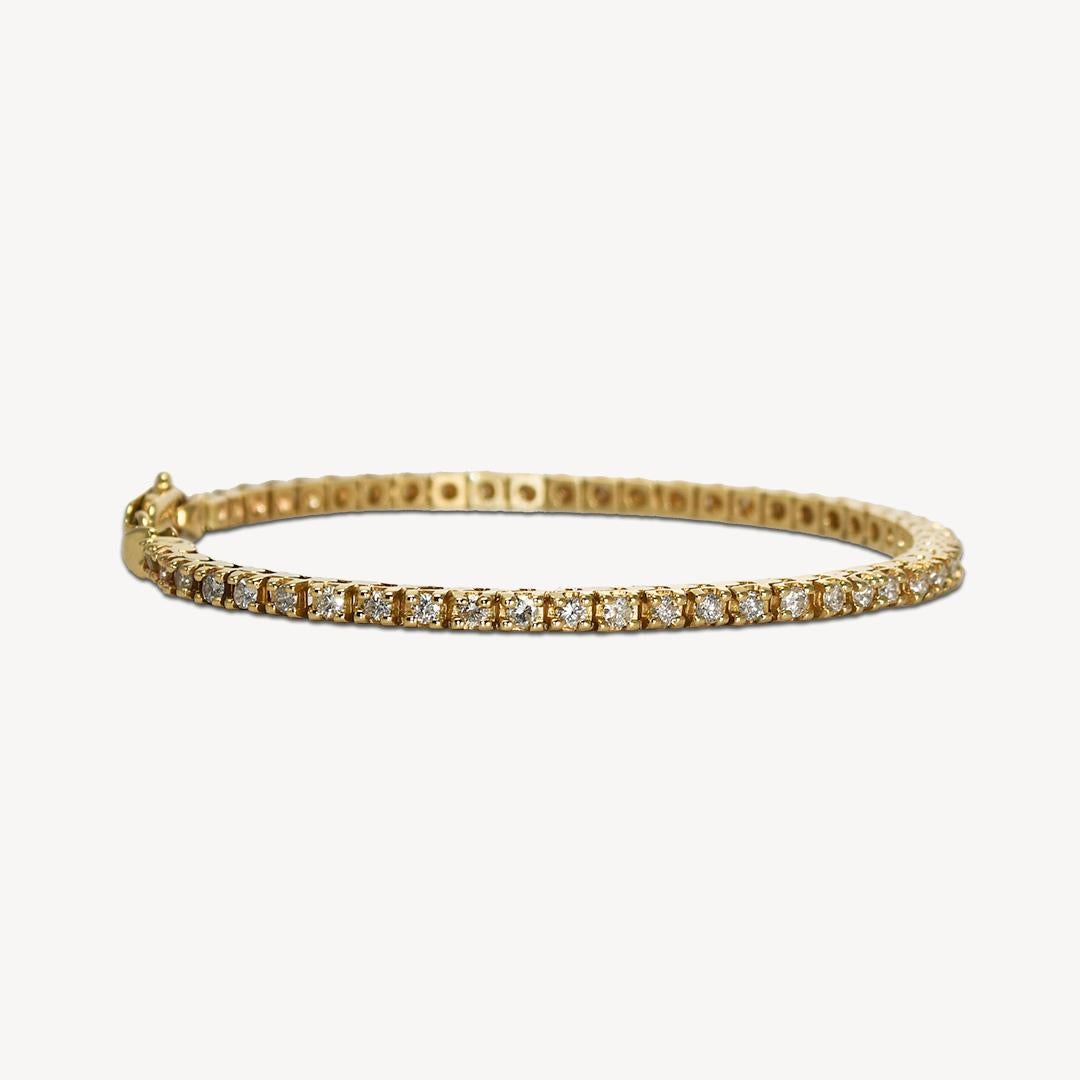 14k yellow gold diamond tennis bracelet.
Stamped 14k and weighs 9 grams gross weight.
The diamonds are round brilliant cuts, very brilliant, and appear to be white, H, i, j color range, Si to i1 clarity range, 1.50 total carats.
The bracelet