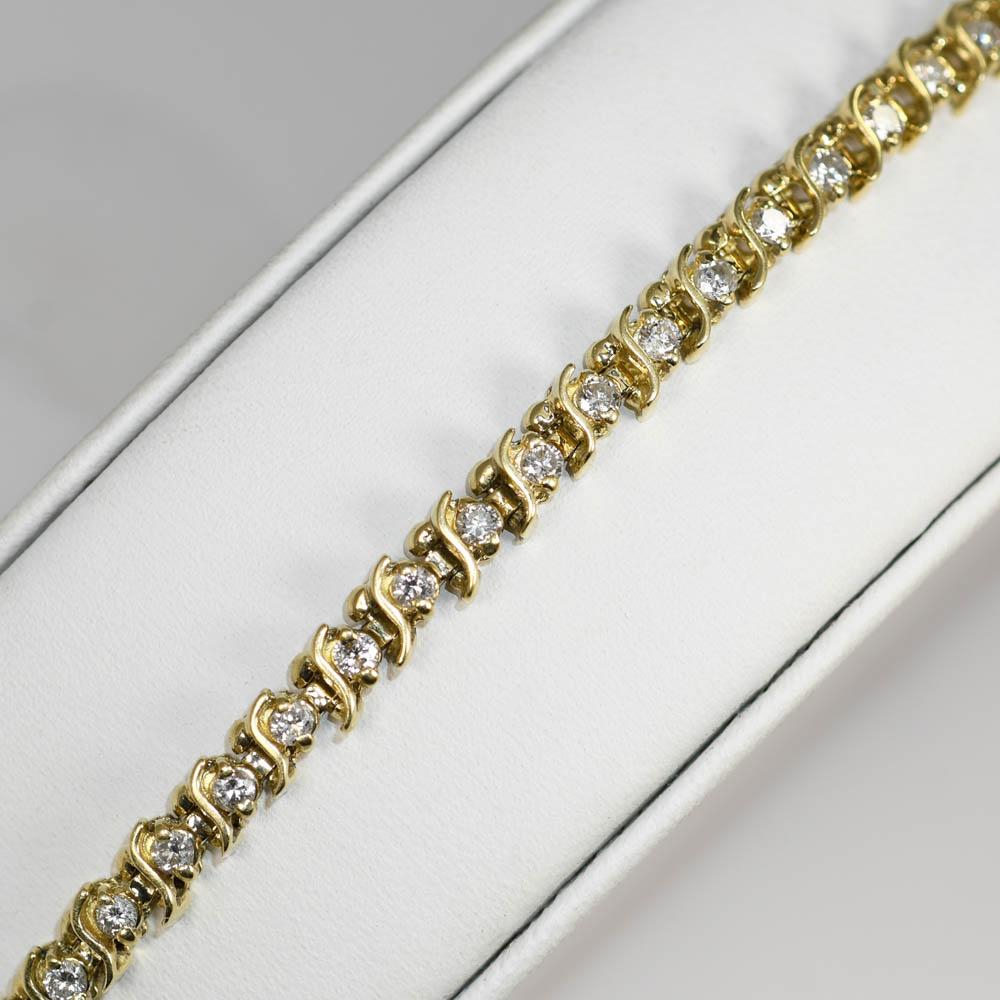 14k Tennis Bracelet with 43 Diamonds 1.50tdw

Color Range G-H, Clarity SI1-SI2

Weighs 11.5g 

will fit up to 7 1/2in wrist

