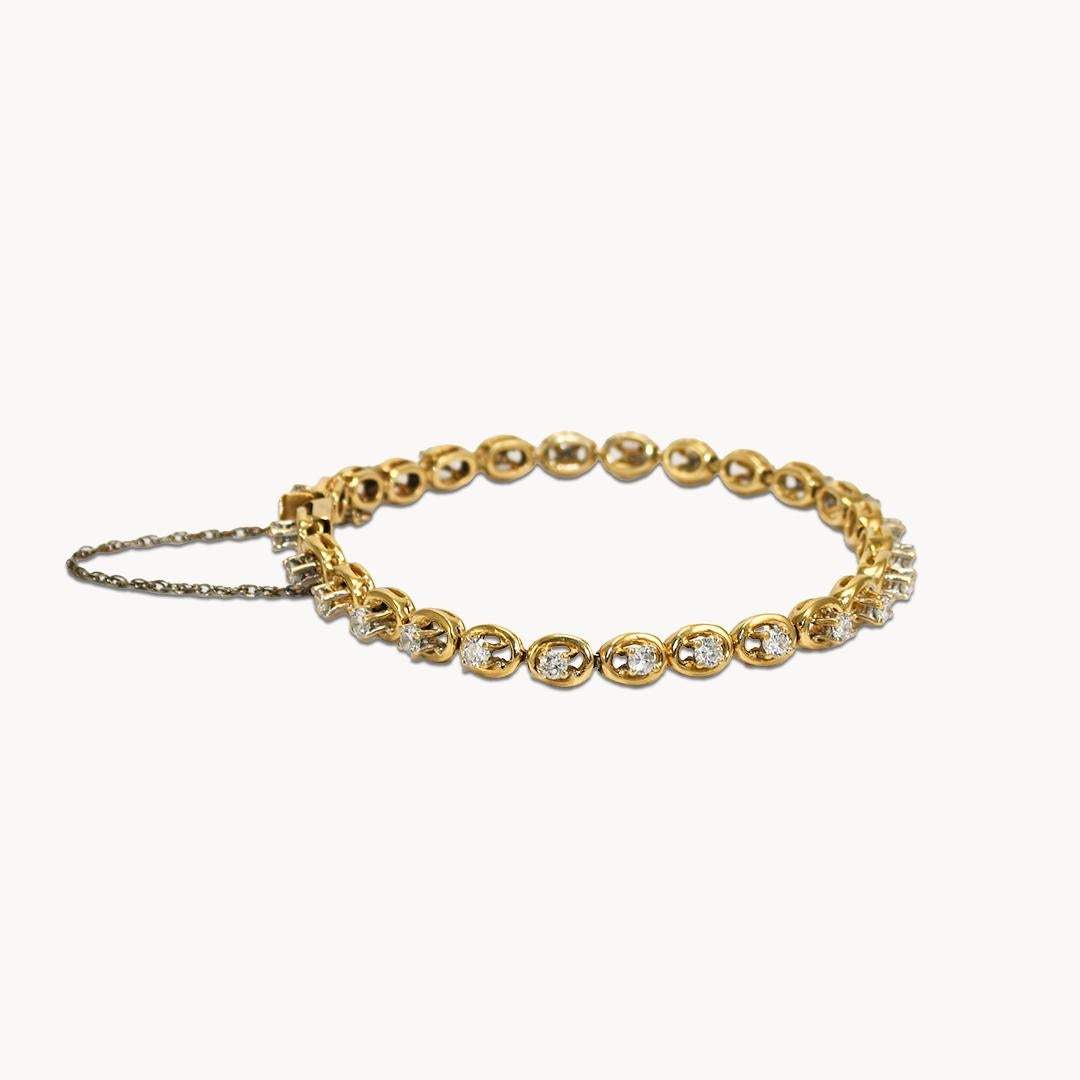 14k Yellow Gold Tennis Bracelet with 2.50tdw.
The Diamonds are prong set and elevated on circular-shaped links.
VS-SI,(mostly SI), H-I Color.
Stamped 14k, (test 54% on X-ray).
Weighs 18.3 grams.
Fits a 71/4in wrist.