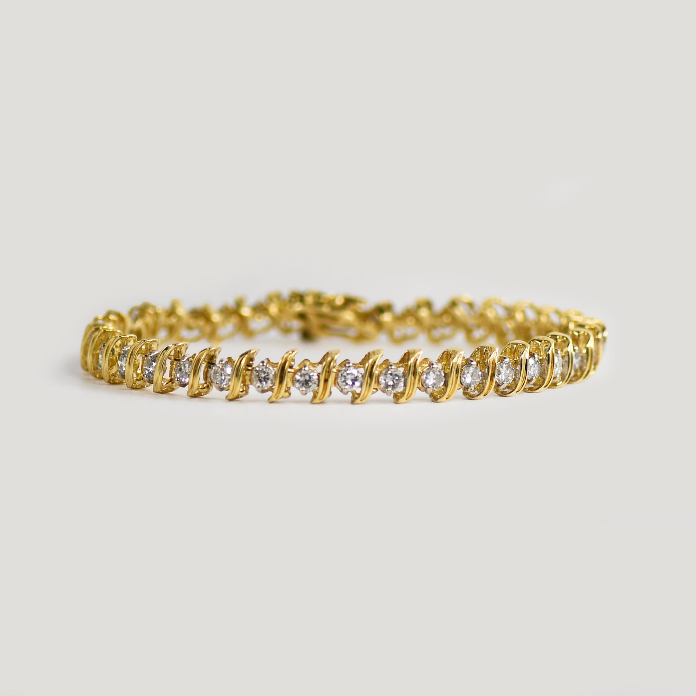 Diamond tennis bracelet in 14k yellow gold.
Marked 14k and weighs 12.6 grams.
There are 38 round brilliant cut diamonds, 3.00 total carats, g to h color, si to i1 color.
The bracelet measures 7 1/4