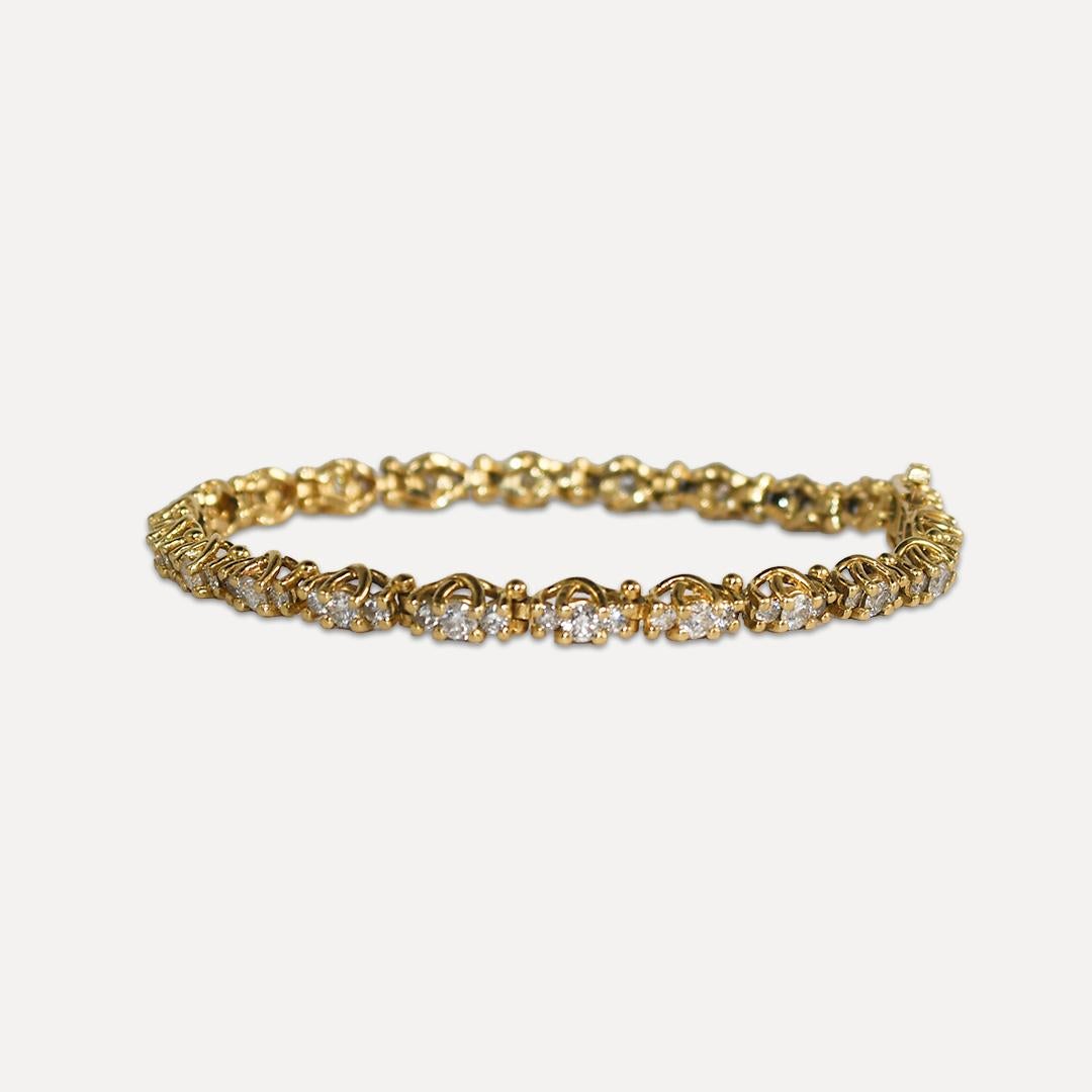 14k Yellow Gold Diamond Tennis Bracelet. 
The diamonds are round brilliant cuts with SI-I1 clarity and J-K-L color.
The total carat weight is 3.75ct.
Weighs 14.2 grams.
Fits a 7 1/4in wrist comfortably. 