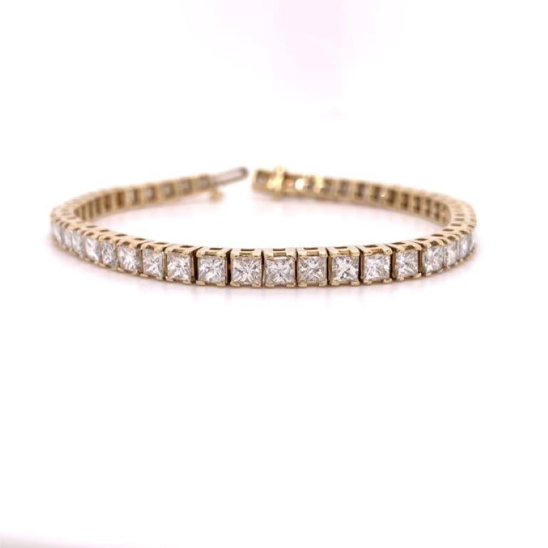 A fine dazzling classic princess cut diamond tennis bracelet crafted in 14 karat yellow gold. It has a total of 51 diamonds. This diamond bracelet totals 7-1/2 carat weight and weighs 14.71 grams. It has also has a safety clasp so you can wear it