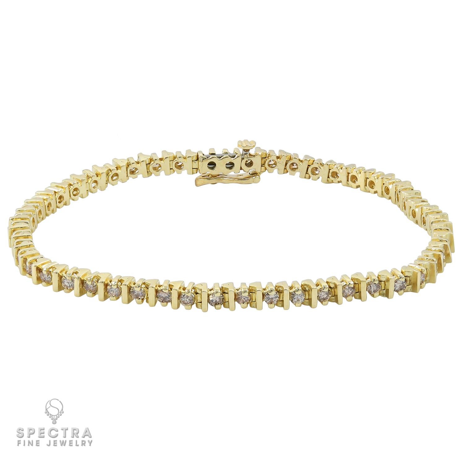 A tennis bracelet comprising of 50 diamonds weighing a total of 2.5 carats. Each diamond weighs 0.05 carat.
Diamonds are natural, not certified, with H-I color, VS-SI clarity.
7.25 inches long.
Metal is 14k yellow gold, gross weight 10.2 gram.