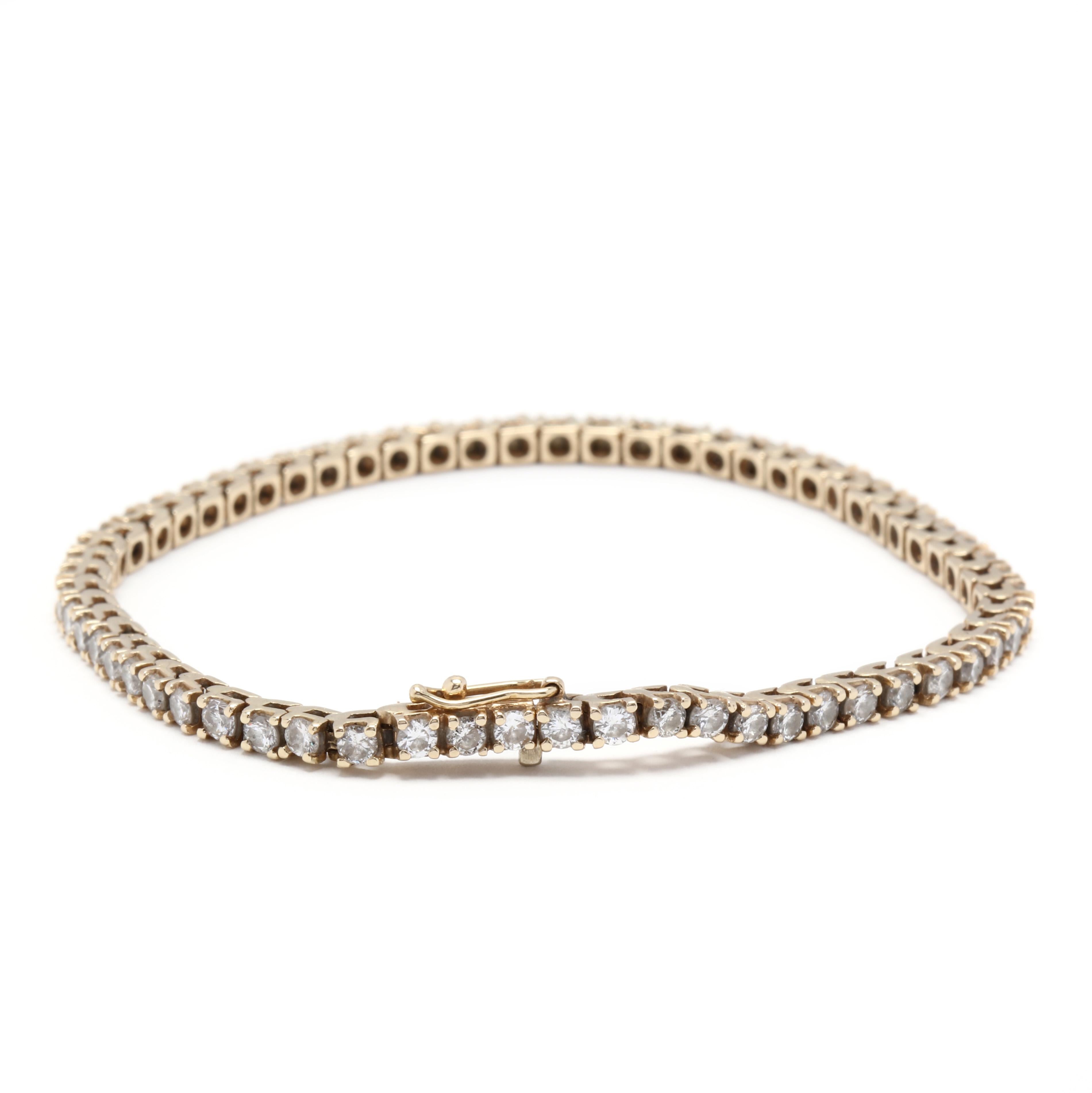 14k yellow gold diamond tennis bracelet. A line bracelet set with 2.5mm diamonds in four prongs around the length of the bracelet. This style is timeless and is classic on its own or stacked with other bracelets!

Stones:
- diamonds, 62 stones
-