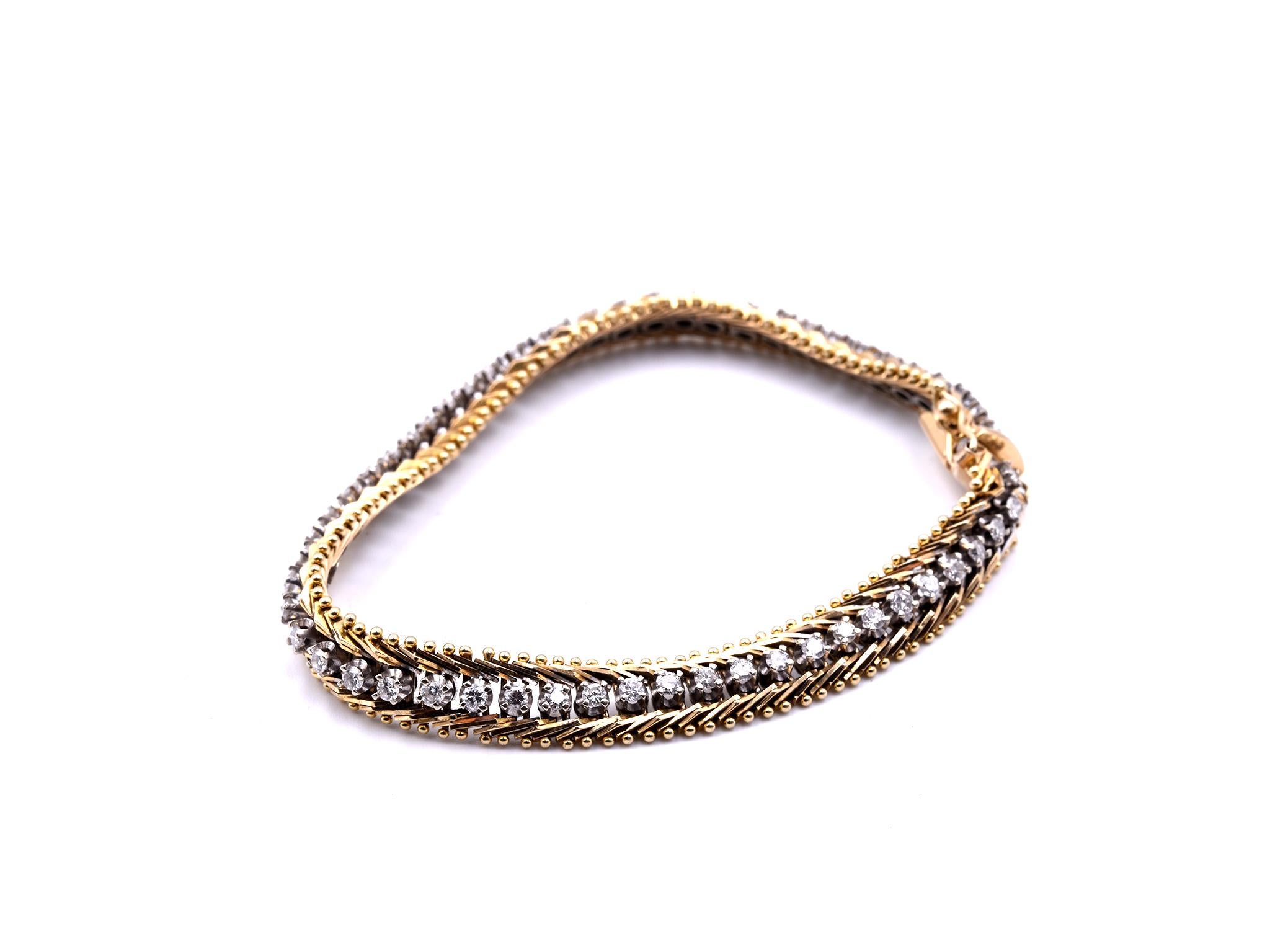 Designer: custom
Material: 14k yellow gold
Diamond: 55 round brilliant cut = 1.65cttw
Color: I
Clarity: SI1-2
Dimensions: bracelet will fit a 7 ½ inch wrist and it is 7.98mm wide
Weight: 19.60 grams
