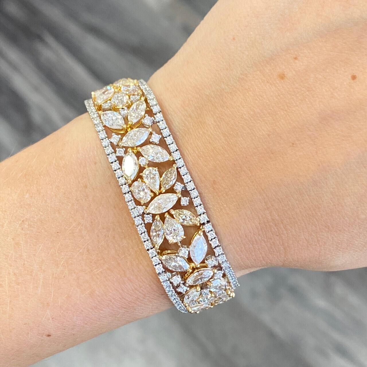 Specifications:
Custom made in Los Angeles, CA
Metal: 14K Yellow Gold  
Weight: 38.74 Gr
Main Stone: Marquise cut diamond 24.05cttw  
Side Stones: Round Diamonds 3.24 ctw
Color: Near Colorless
Clarity: Included
Length: 7 Inch