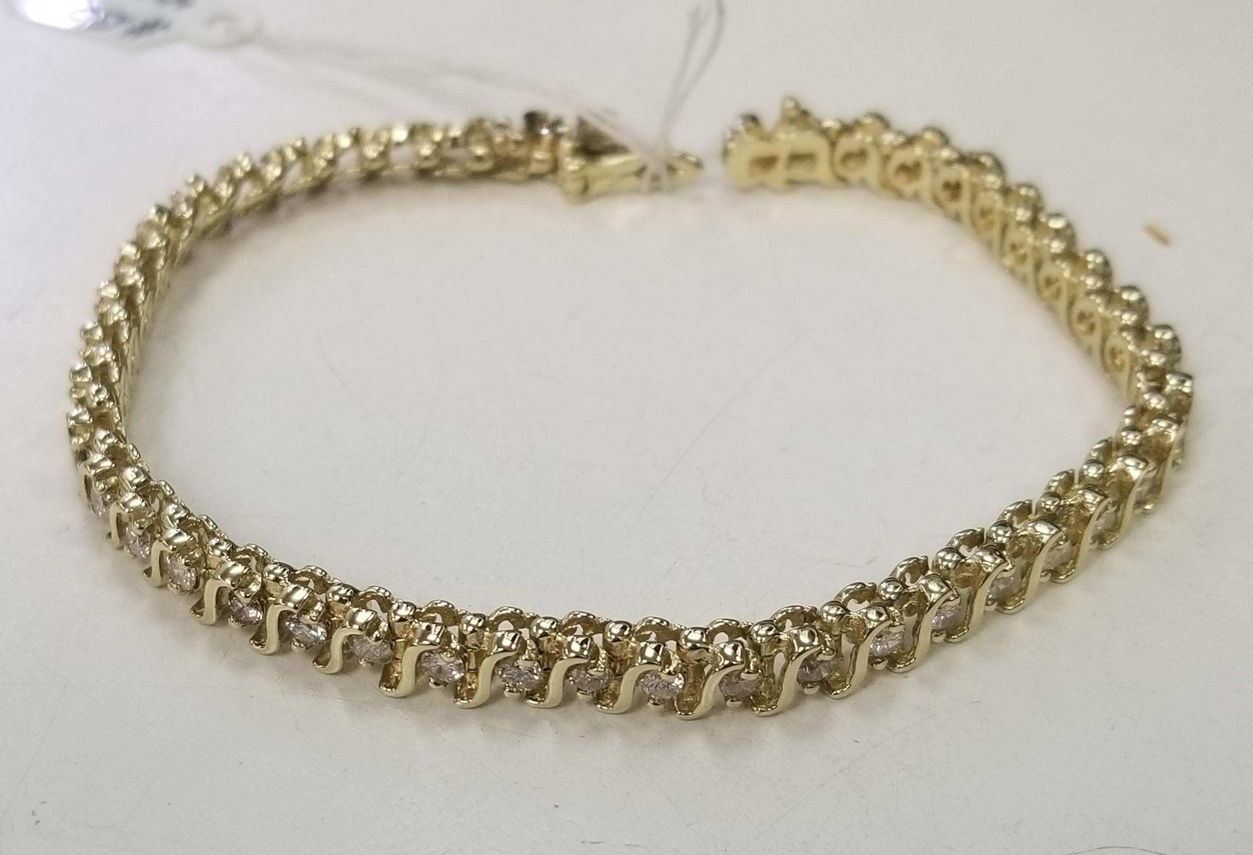 Specifications:
    main stone:ROUND DIAMONDS
    diamonds: 44 PCS
    carat total weight:approximately 3.10 CTW
    color: H-I
    clarity: SI1-SI3
    brand:CUSTOM MADE
    metal:14K yellow gold
    type:BRACELET
    weight:16.3 gr
    length:7
