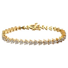 Bracciale tennis con diamanti a triangolo in oro giallo 14k