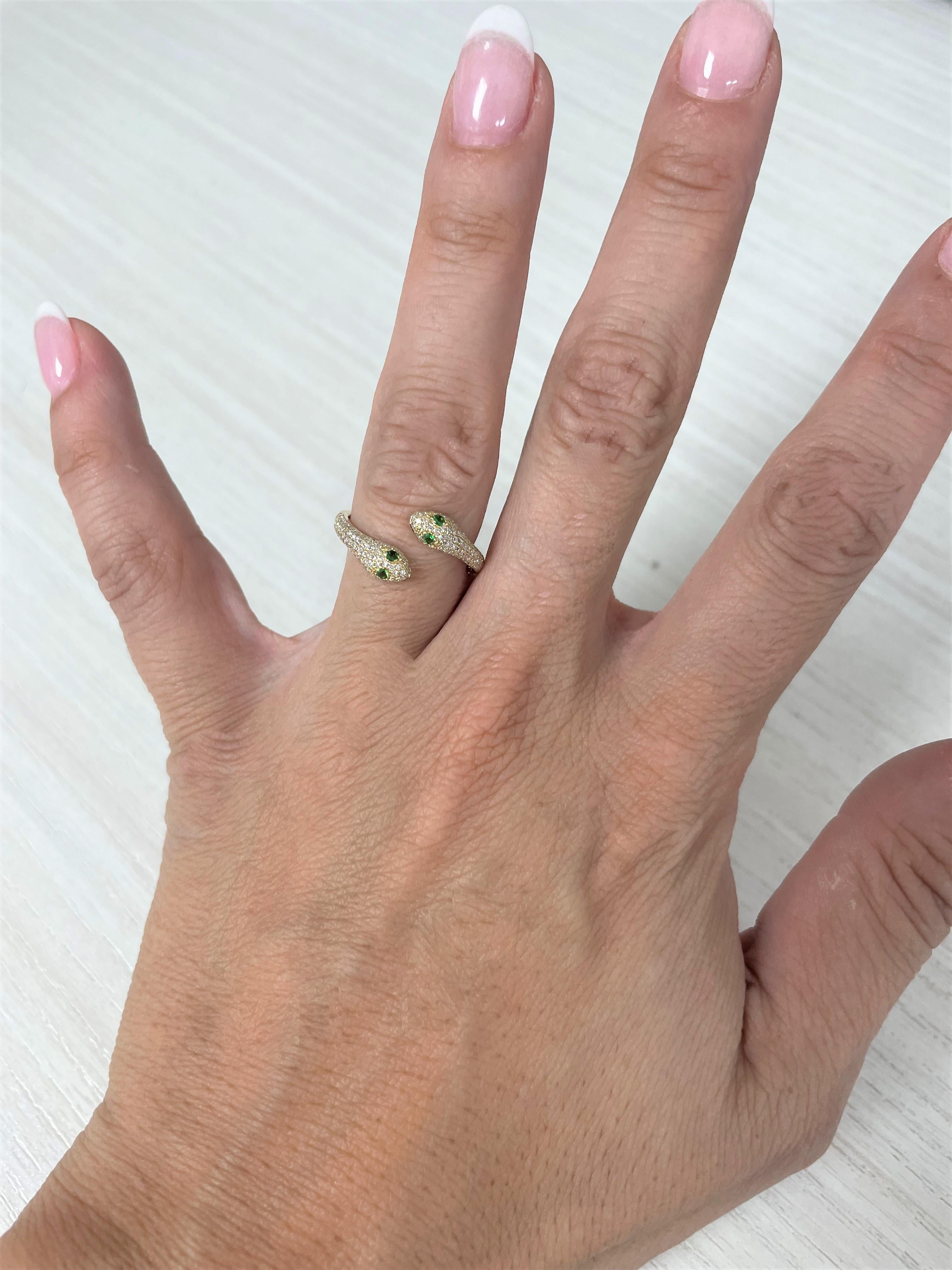 This Stunning and Charismatic Snake ring is crafted of 14K Gold and features approximately 0.35 ct. of Diamonds and 4 Tsavorites approximately 0.06 ct. Available in your choice of Yellow or Rose Gold. Wraps Gracefully around your finger for that