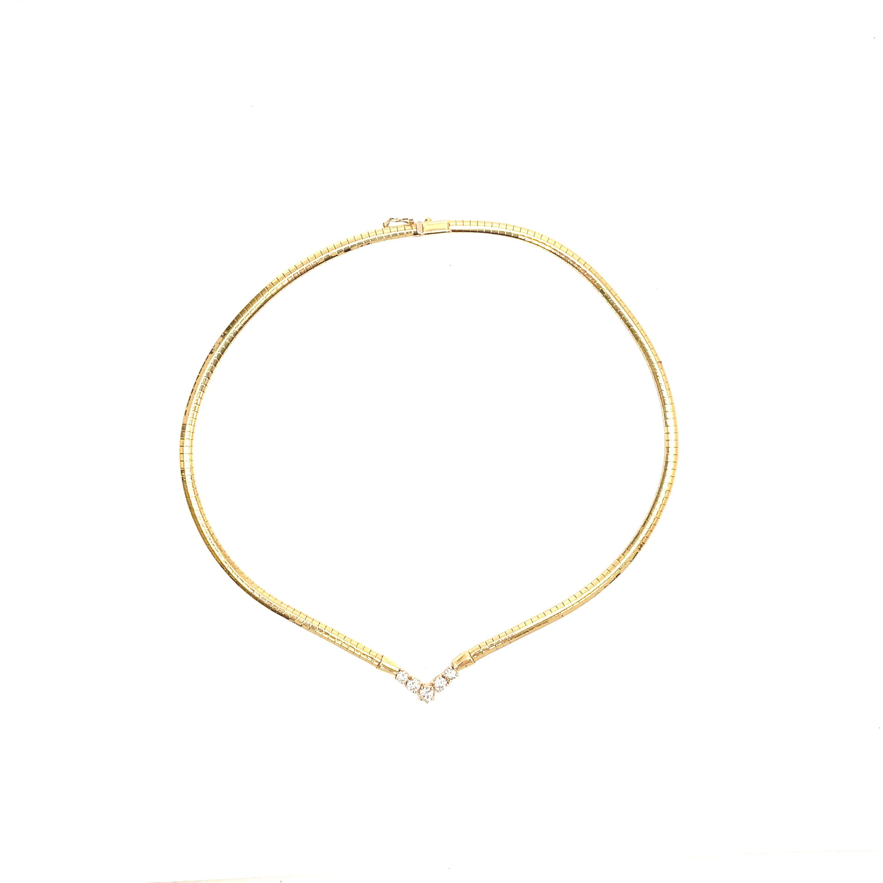 This classic diamond necklace in a 'V-shaped' design is set in 14K yellow gold. What is not to love about this stunning necklace? The warm golden yellow omega chain rests beautifully along the collar bone and is united by five bright dazzling white