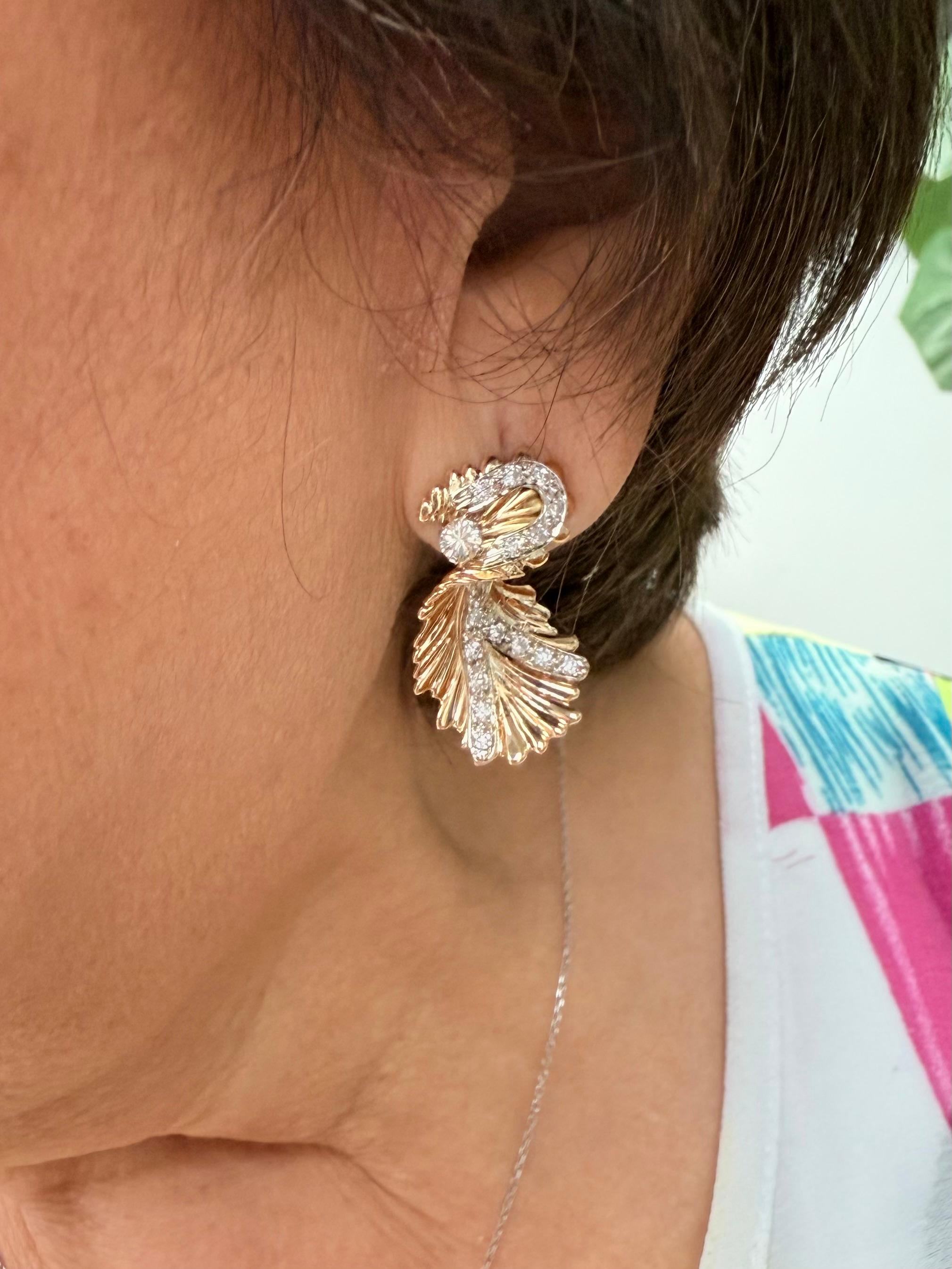 14k Yellow Gold Diamond Vintage Organic Style Drop Earrings Circa 1960s.

The 14k Yellow Gold Diamond Vintage Organic Style Drop Earrings were made in the 1960s.  These earrings have a most unusual organic design that is quite unique.  Something