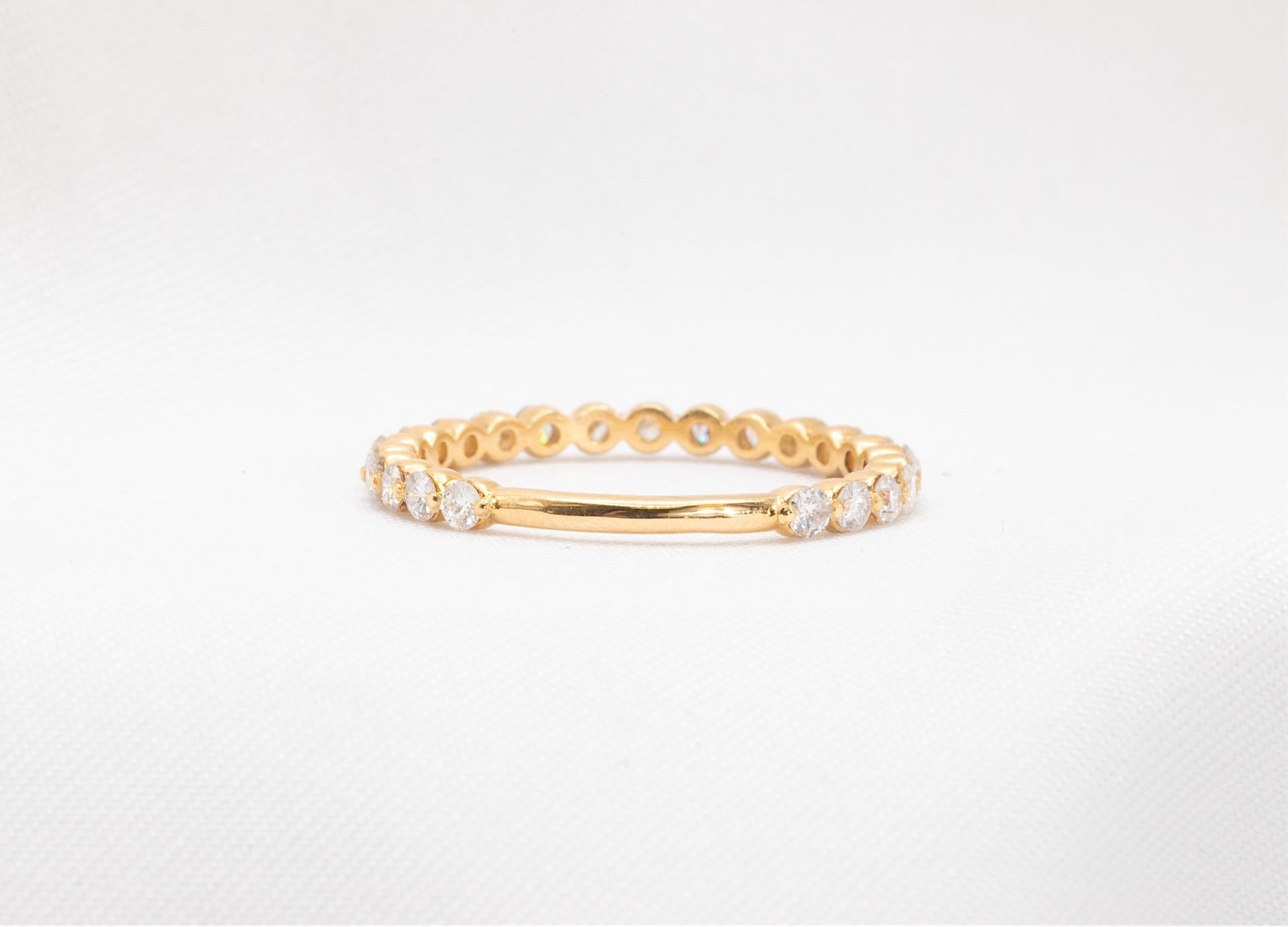 Floating Diamond Wedding Band in 14k Gold  

This elegant floating diamond wedding band features 22 natural round diamonds with white SI quality, totaling approximately 0.55 carats. The diamonds are set to go three-quarters of the way around the
