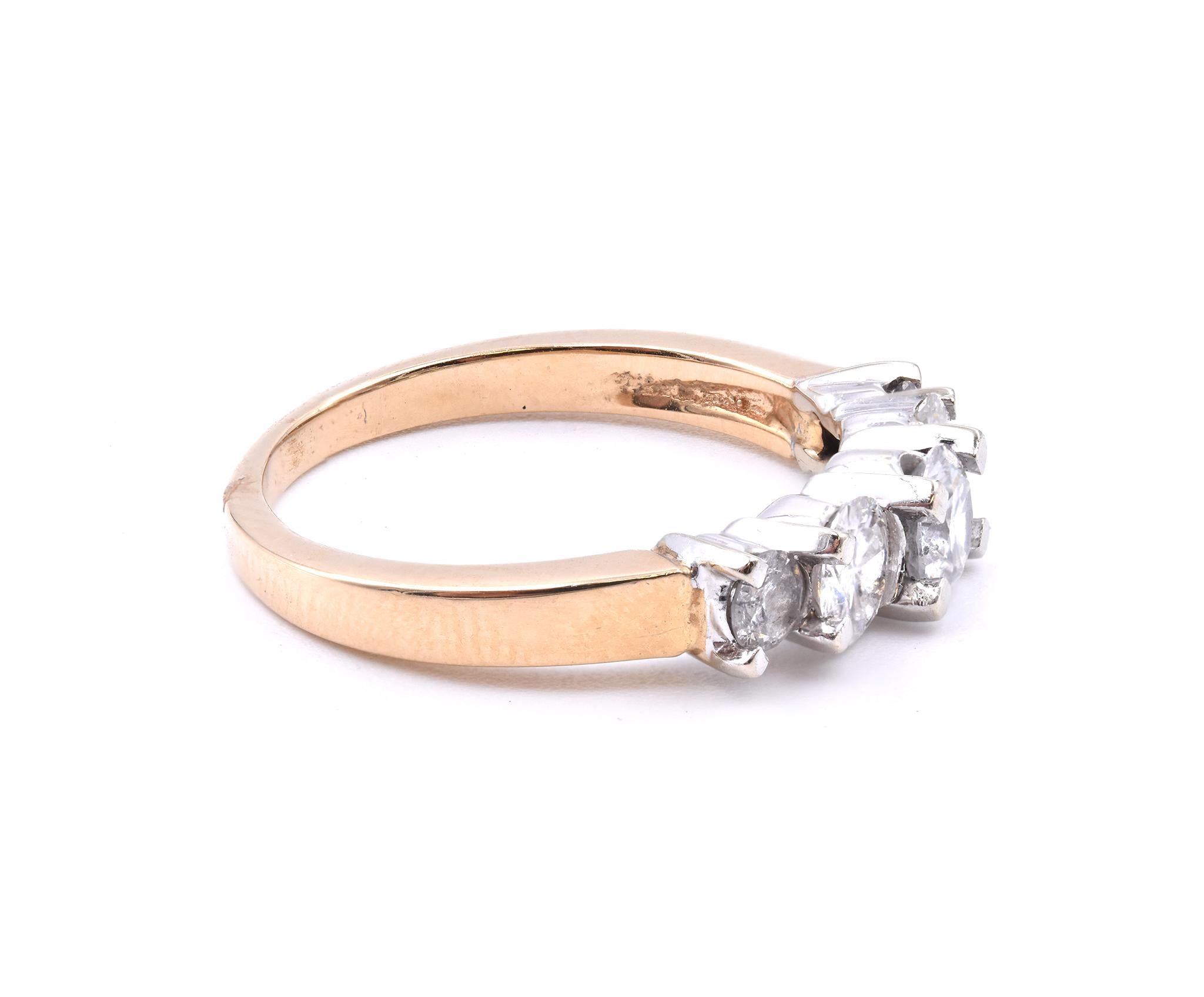 Designer: custom
Material: 14k yellow gold
Diamonds: 5 round brilliant cut = 1.00cttw
Color: H
Clarity: I1
Size: 6 ½  (please allow two additional shipping days for sizing requests)
Dimensions: band measures 2.63mm in width
Weight: 3.20 grams