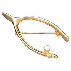 Spillone con diamante in oro giallo 14k