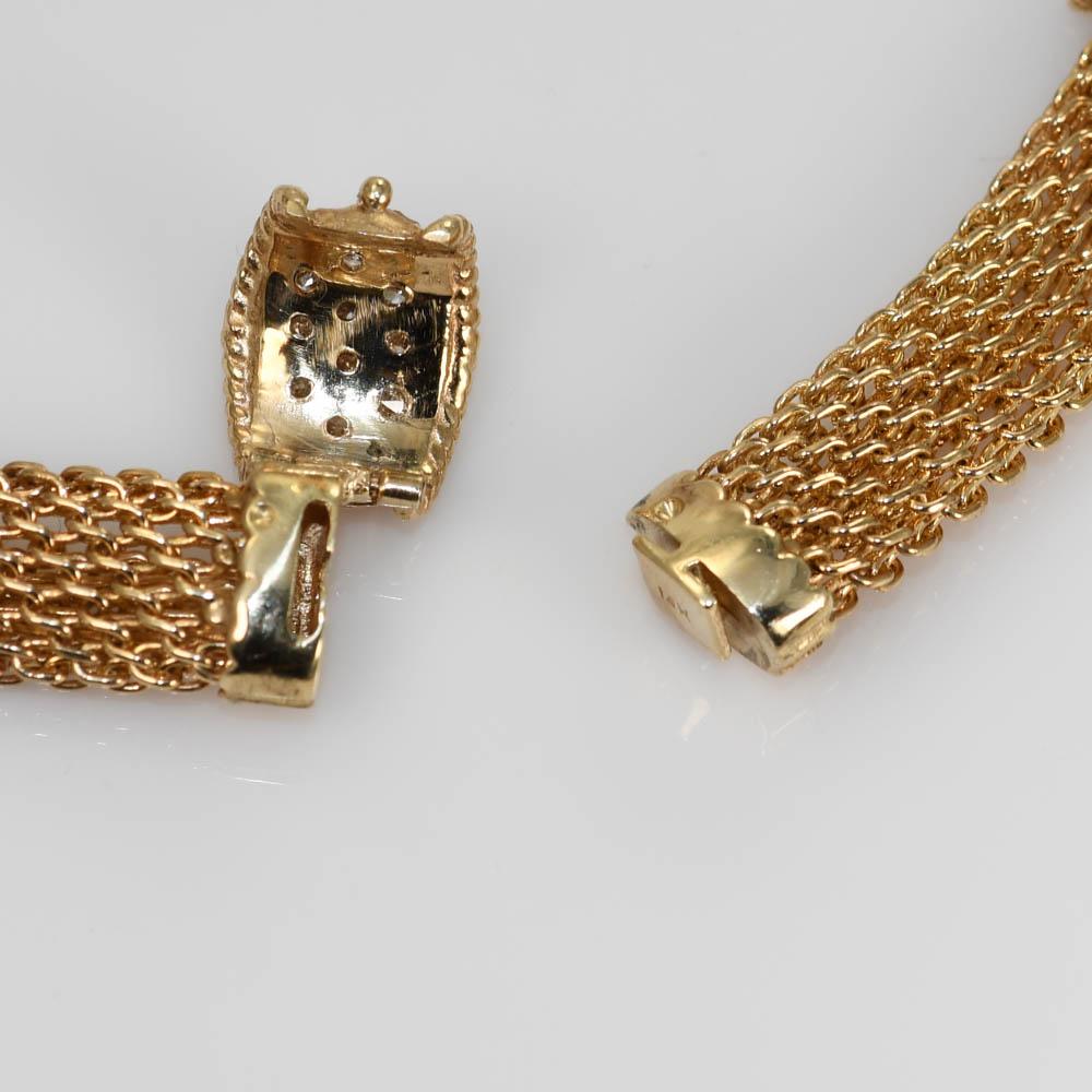 Ladies 14k yellow gold and diamond choker necklace.
Stamped 14k and weighs 58.6 grams.
The diamonds are round brilliant cuts, 3.00 total carats, G to H color, VS to Si clarity.
The necklace is an intricately woven link measuring 15 inches long and