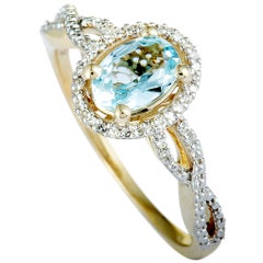 14 Karat Yellow Gold Diamonds and Aquamarine Oval Ring