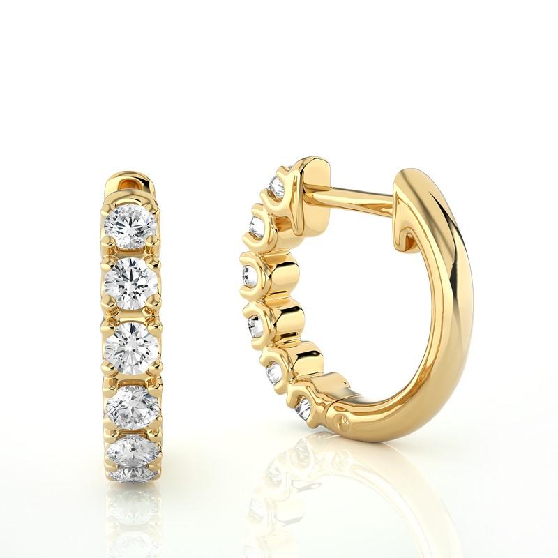 Elevate your style with these 14K Yellow Gold Diamonds Huggie Earrings, adorned with a total of 0.46 carats of dazzling diamonds. Crafted with precision, these huggie earrings feature a sleek, contemporary design in lustrous 14K yellow gold. The