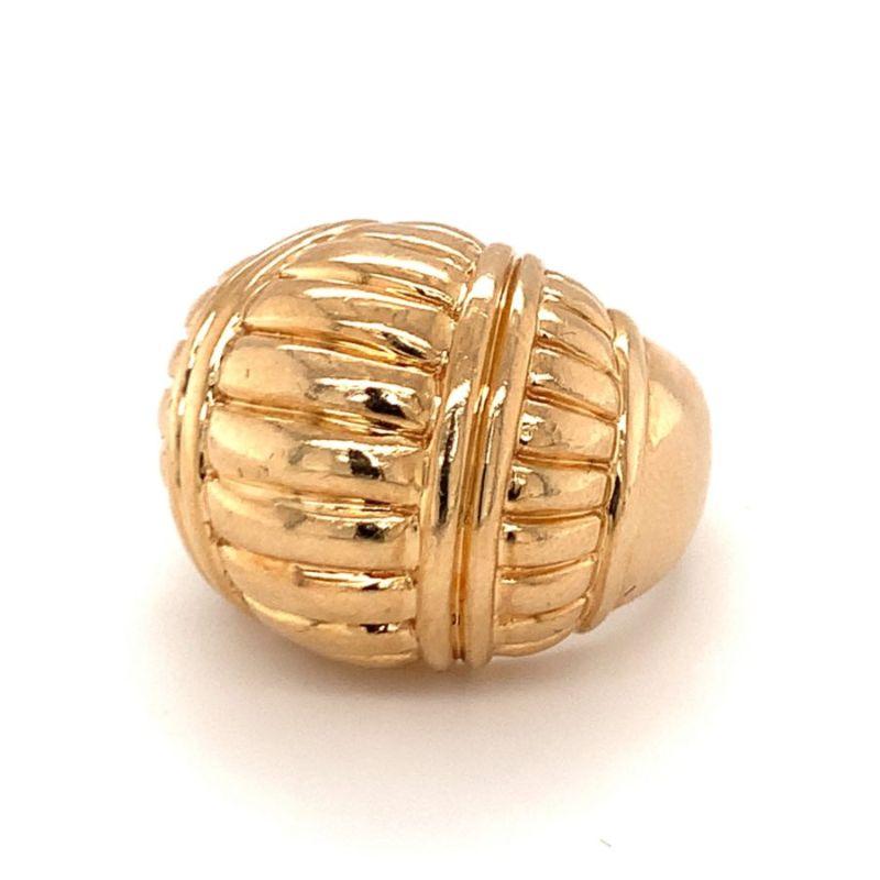 One 14K yellow gold dome ring enhanced by a ribbed gold design with a high polish finish. Signed “Dankner” by Henry Dankner. Circa 1970s.

Glowing, glamorous, glossy.

Additional information:
Metal: 14K yellow gold
Circa: 1970s
Stamp/Hallmark: Henry