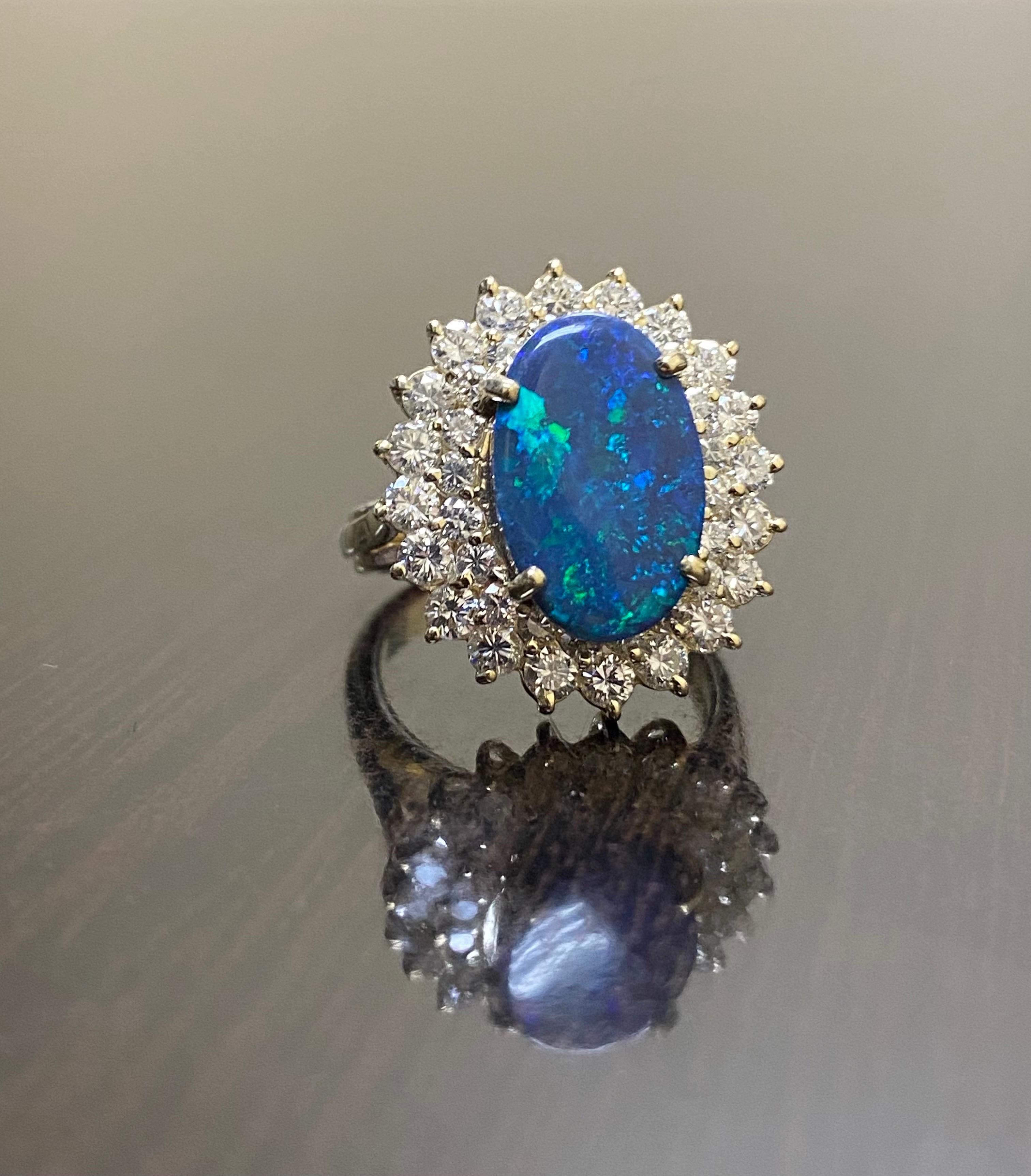 DeKara Designs Classic

Metal- 14K Yellow Gold, .583.

Stones- 1 Oval Australian Black Opal 2.65 Carats, 40 Round Diamonds G-H Color VS2 Clarity 1.65 Carats.

Size- 6, could be sized up or down at no additional cost.

Featuring a DeKara Design