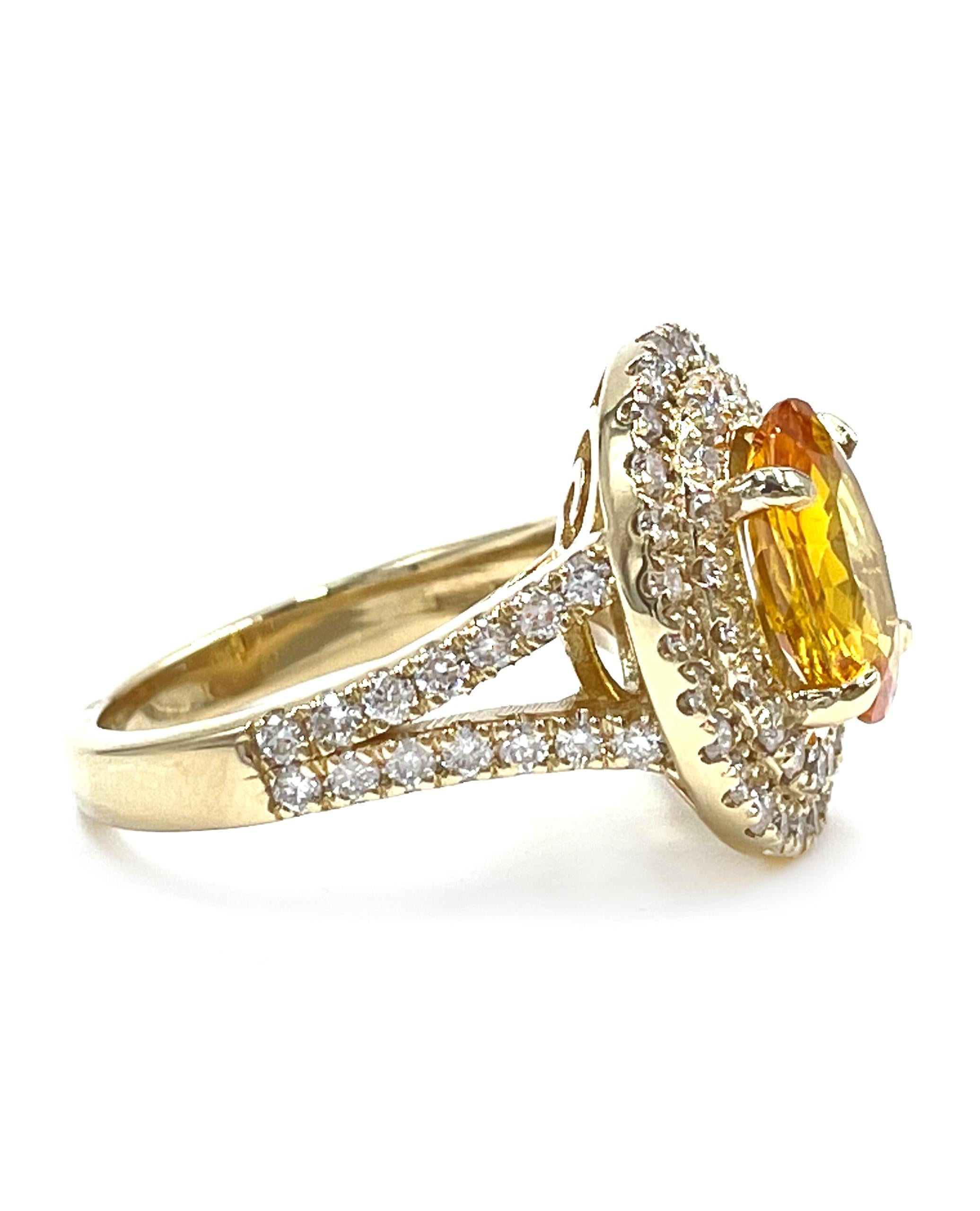 14K yellow gold double halo, split shank ring furnished with 75 round faceted diamonds weighing 1.50 carats total. In the center there is one oval shape yellow sapphire weighing 2.40 carats.

* Finger size 6.75. Can be sized up or down 2 sizes.