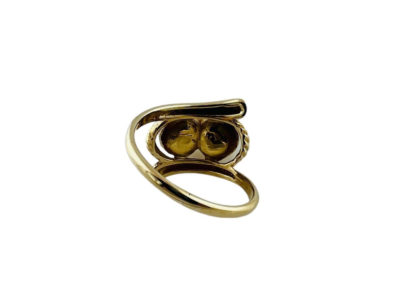 14K Yellow Gold Double Pearl Ring

This lovely pearl ring is set in 14K yellow gold and features two center pearls

Pearls are approx. 6mm each

Front of ring is approx. 17mm in diameter

Sits approx. 8mm high above finger

shank is approx. 1.5