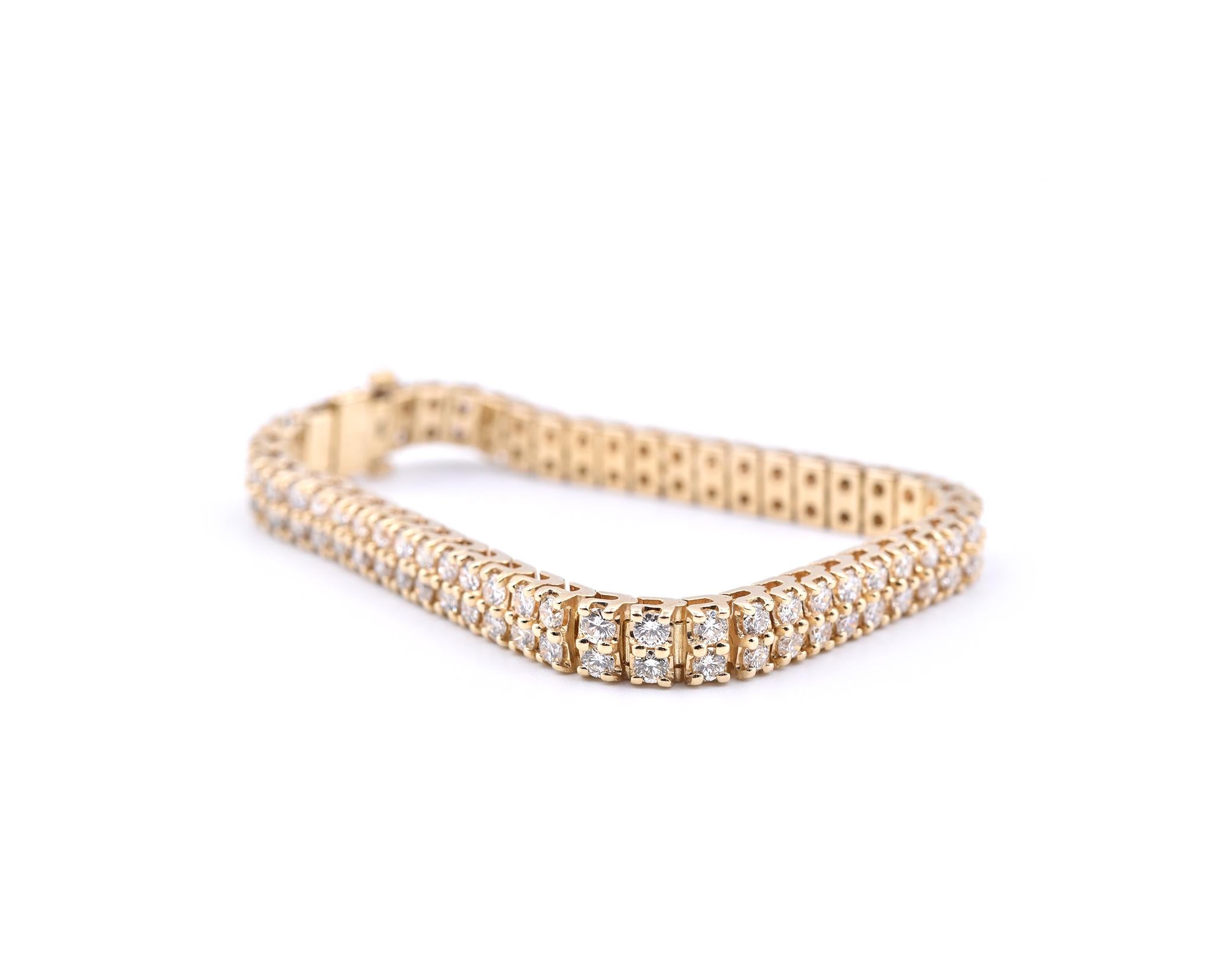 Designer: custom designed
Material: 14k yellow gold
Diamonds: 100 round brilliant cuts = 8.00cttw 
Color: I
Clarity: SI1
Dimensions: bracelet is 7 inches in length, and measures 6.40mm in width
Weight: 31.95 grams