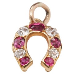 Retro 14K Yellow Gold Edwardian Horseshoe Pendant with Rubies and Old Mine Diamonds