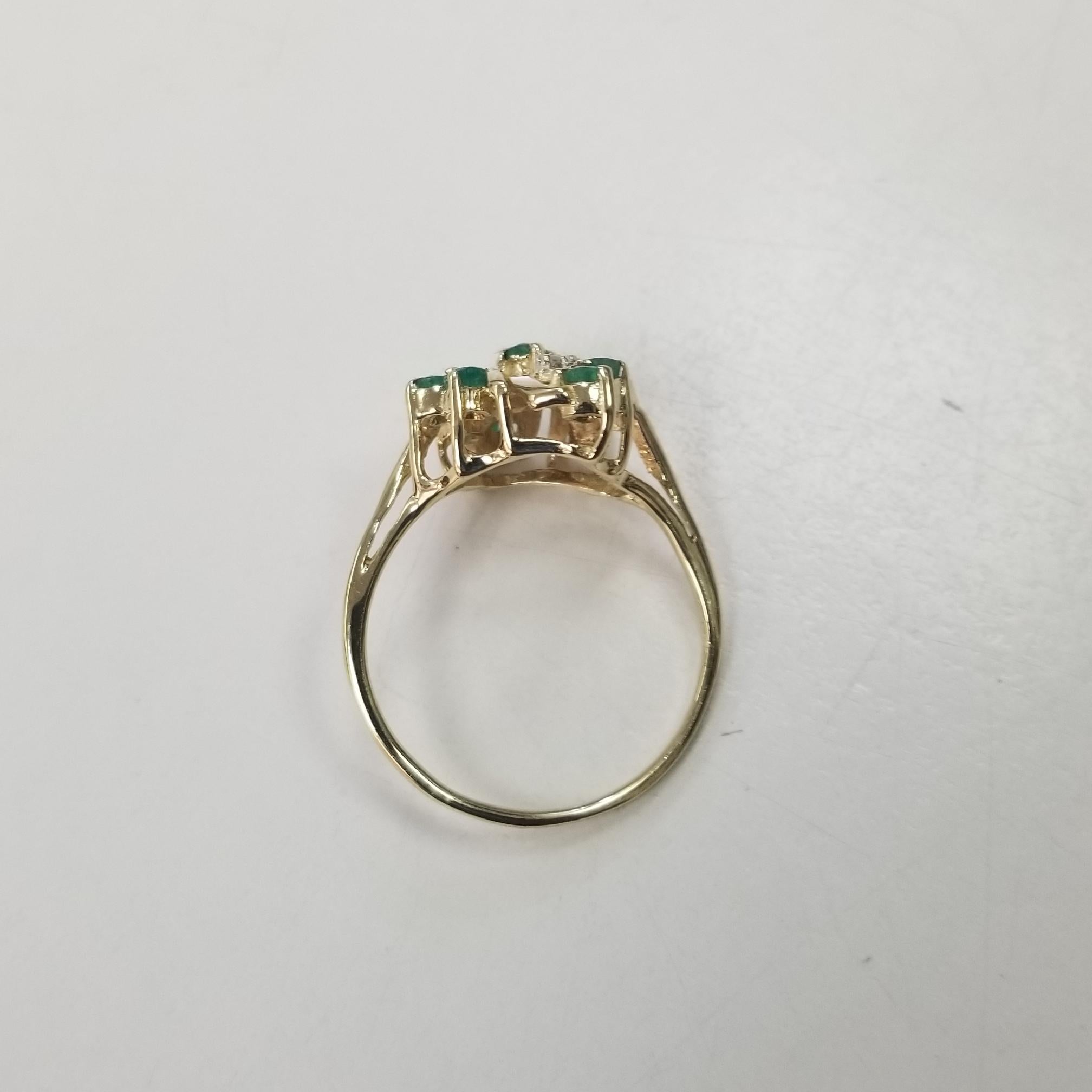 Contemporary 14k Yellow Gold Emerald and Diamond Cluster Ring For Sale