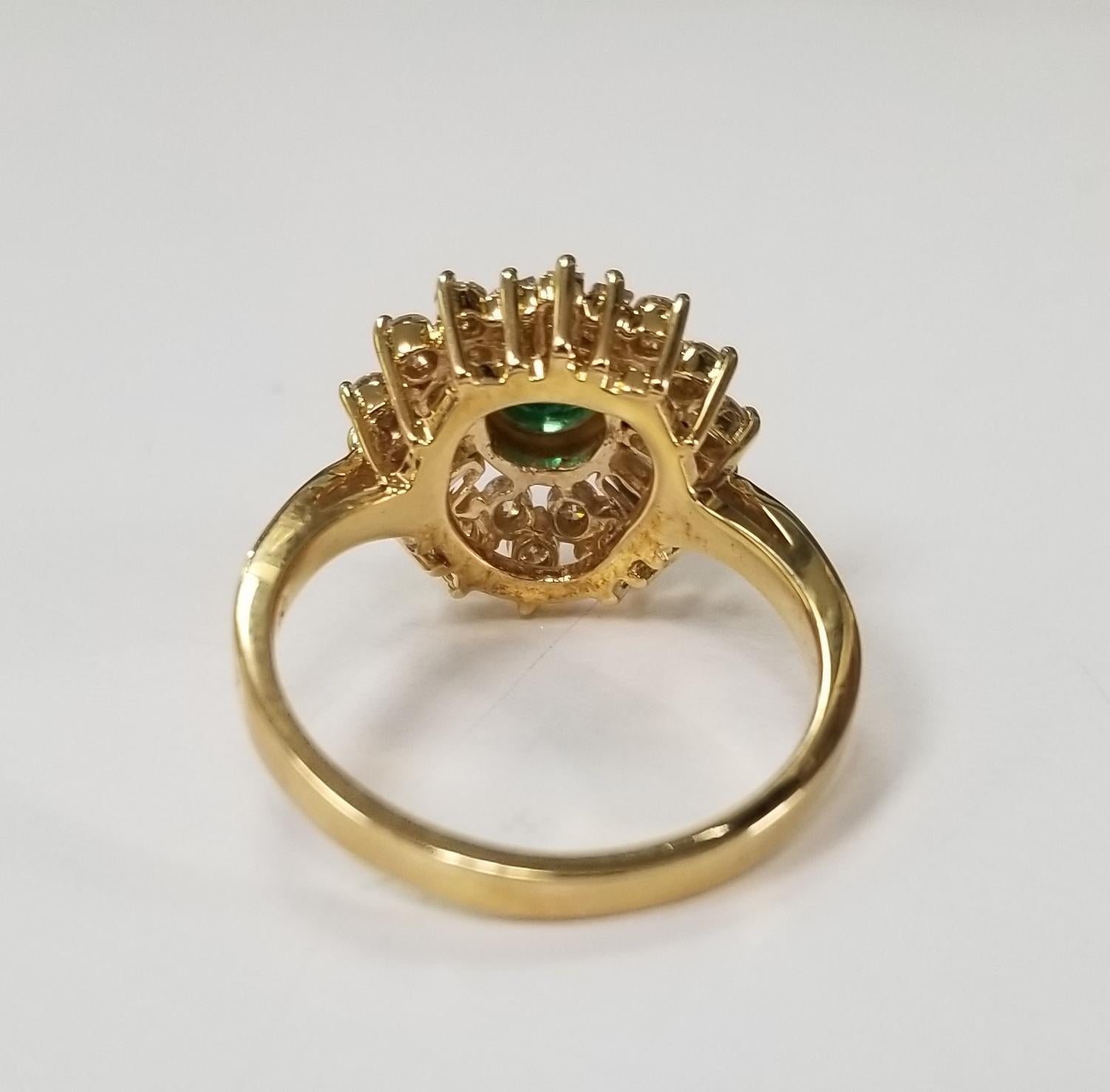 Round Cut 14 Karat Yellow Gold Emerald and Diamond Cluster Ring For Sale