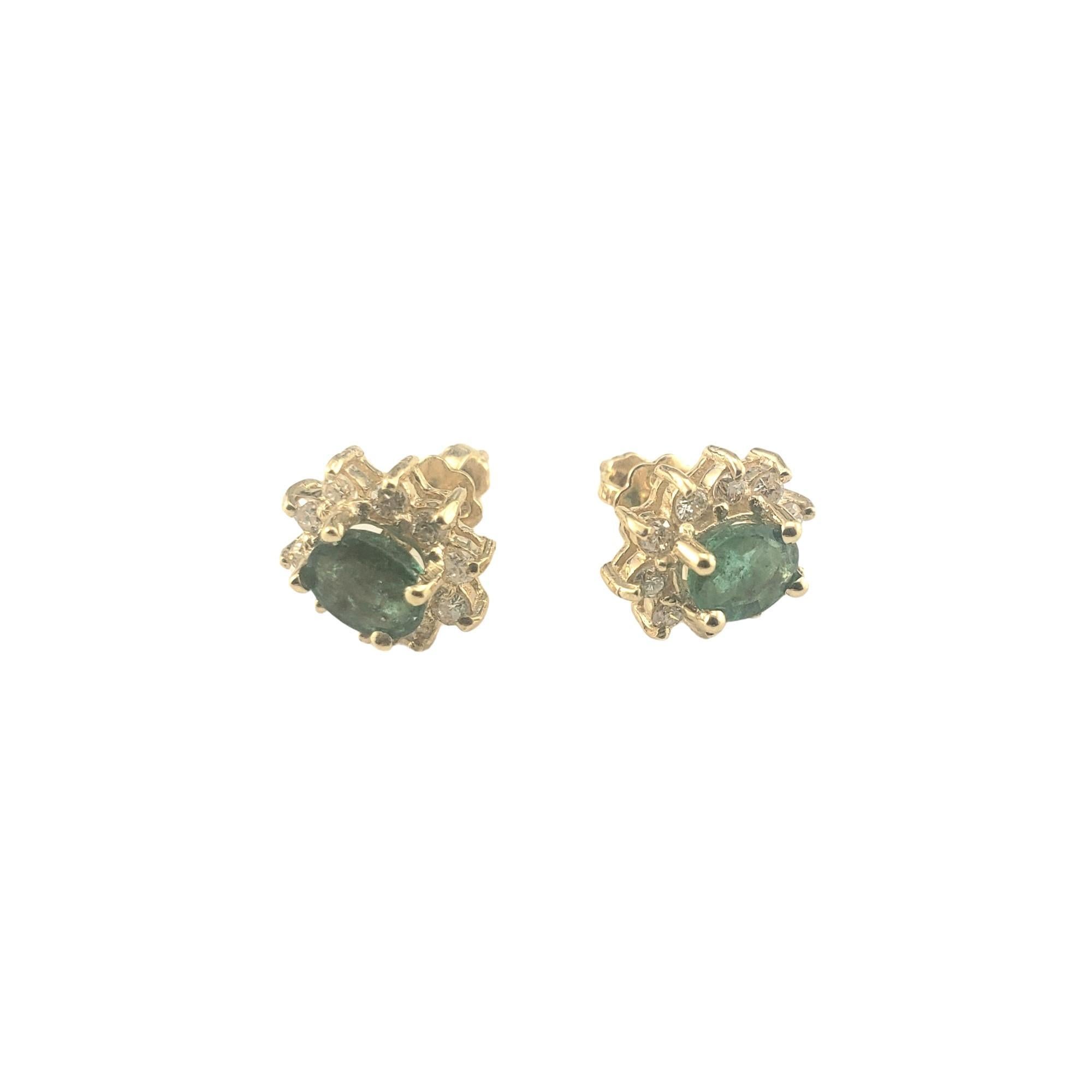 14K Yellow Gold Emerald and Diamond Earrings JAGi Certified-

These stunning earrings each feature one oval cut emerald (4.9 mm x 4 mm) and 10 round brilliant cut diamonds set in classic 14K yellow gold.  

Screw back closures.

Total emerald