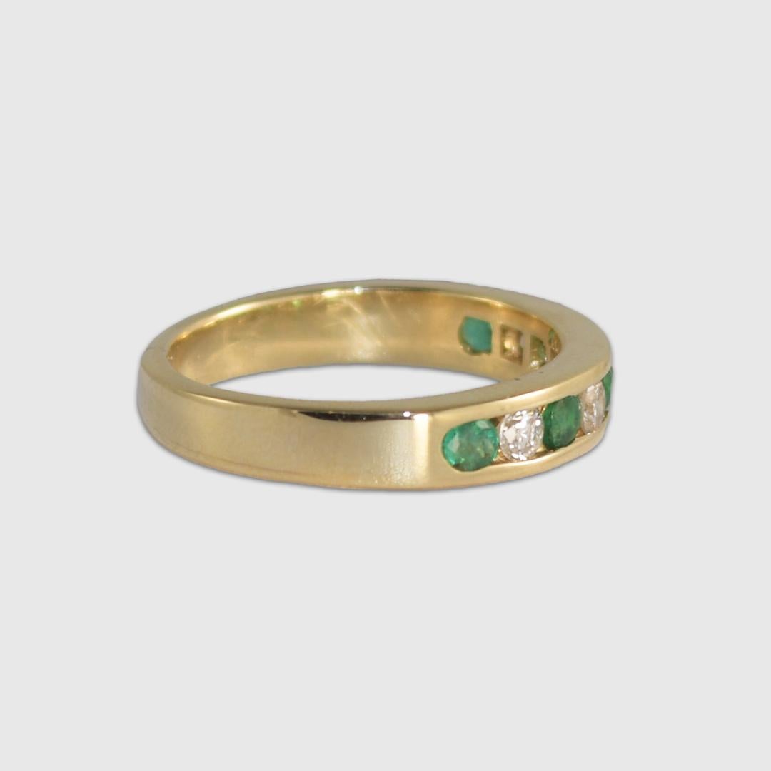 14k yellow gold, emerald, and diamond ring.
Stamped 14k and weighs 4.3 grams.
The diamonds are round brilliant cuts, .25 total carats, H to I color, and Si clarity.
The natural emeralds are round brilliant cuts and .30 total carats.
The ring