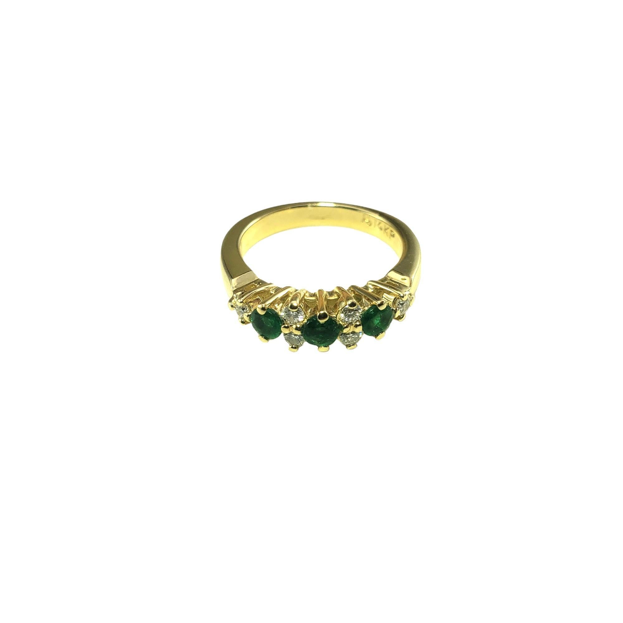 Vintage 14K Yellow Gold Emerald and Diamond Ring Size 6.5 JAGi Certified-

This stunning ring features three round natural emeralds (3.3 mm) and six round brilliant cut diamonds set in classic 14K yellow gold.  Width: 6 mm.  Shank: 3 mm.

Total