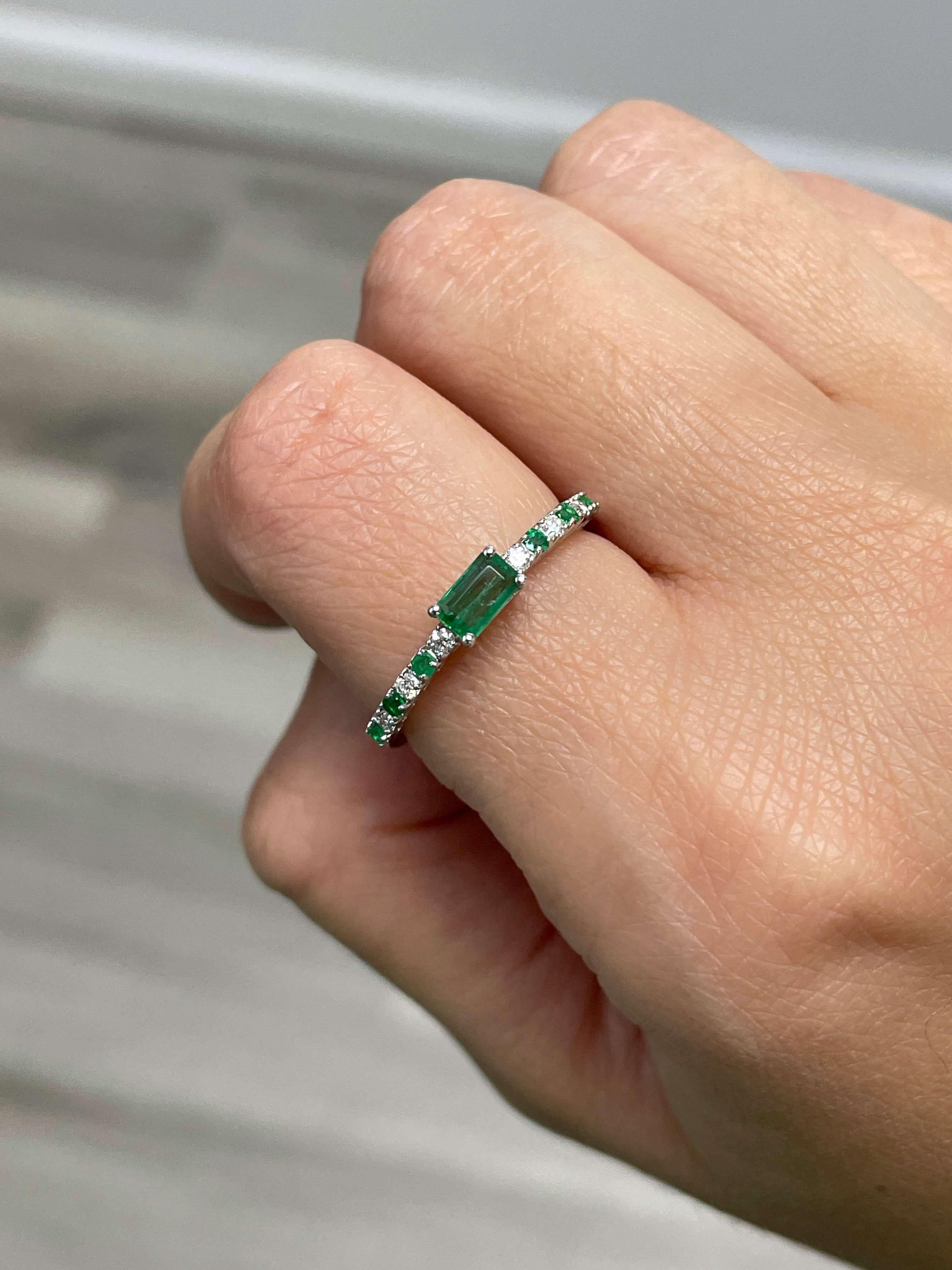 Add a pop of color to your everyday wardrobe with this emerald and diamond ring featuring a beautiful emerald center stone and alternating round diamonds and emeralds. Also available in White Gold.

14K Gold Emerald and Diamond Ring
5 x 3 Center