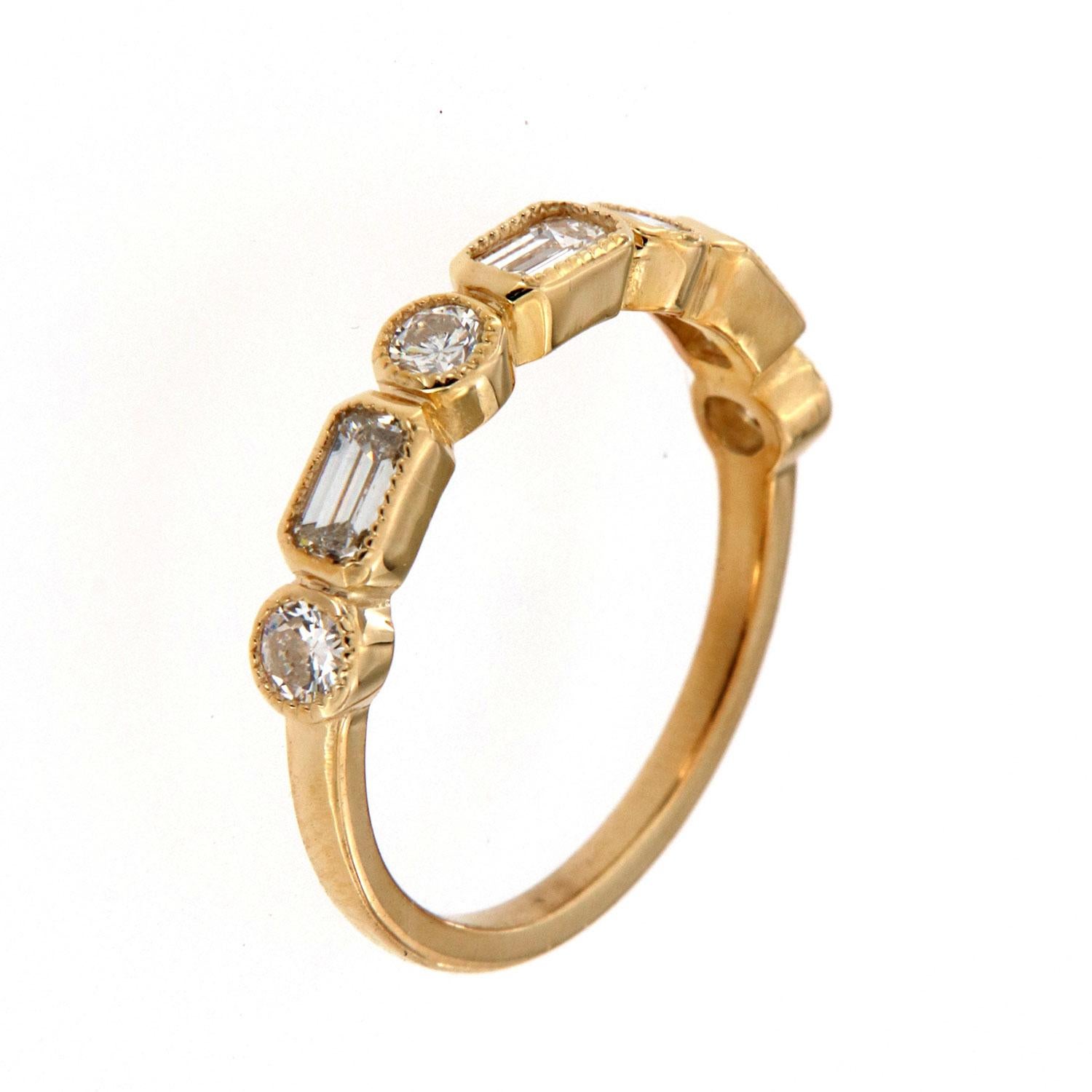 This yellow gold band features three(3) Emerald-shaped diamonds in a total weight of 0.56 carat alternating with four (4) brilliant round diamonds in a total weight of 0.31 carat. A thin Milgain designed bezel surrounds each diamond on top of a 1.6