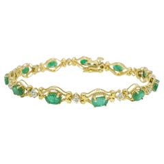 Bracciale con smeraldo ovale naturale e diamanti a 14 carati