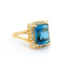 14k Yellow Gold Emerald Cut Blue Topaz w/ 0.44ctw Halo Diamond Cocktail Ring