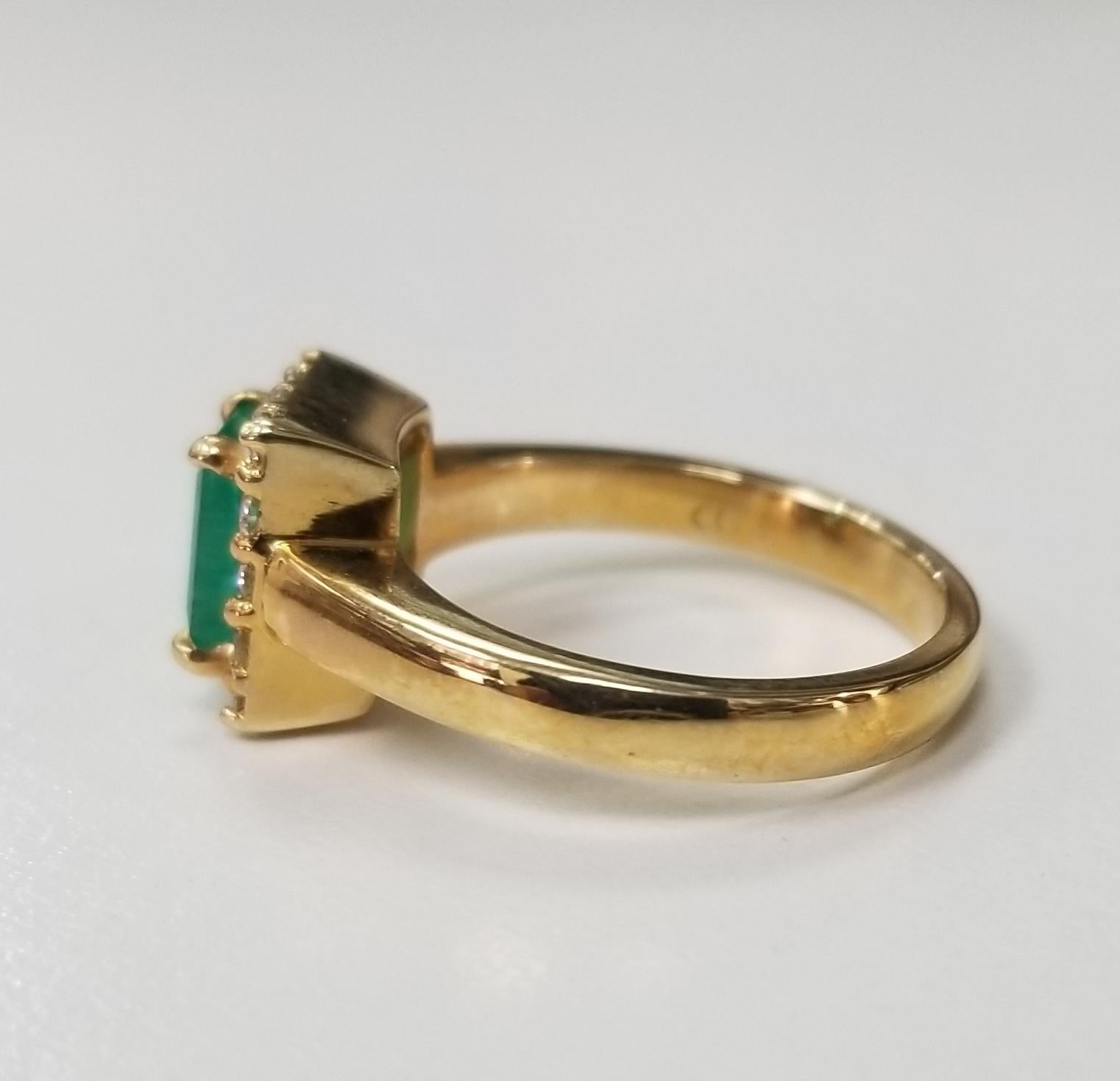 Contemporary 14 Karat Yellow Gold Emerald Cut Emerald and Diamond Ring For Sale