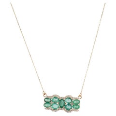 Collana con ciondolo di smeraldo e diamante in oro giallo 14K con smeraldo ovale da 0,90 carati Mod