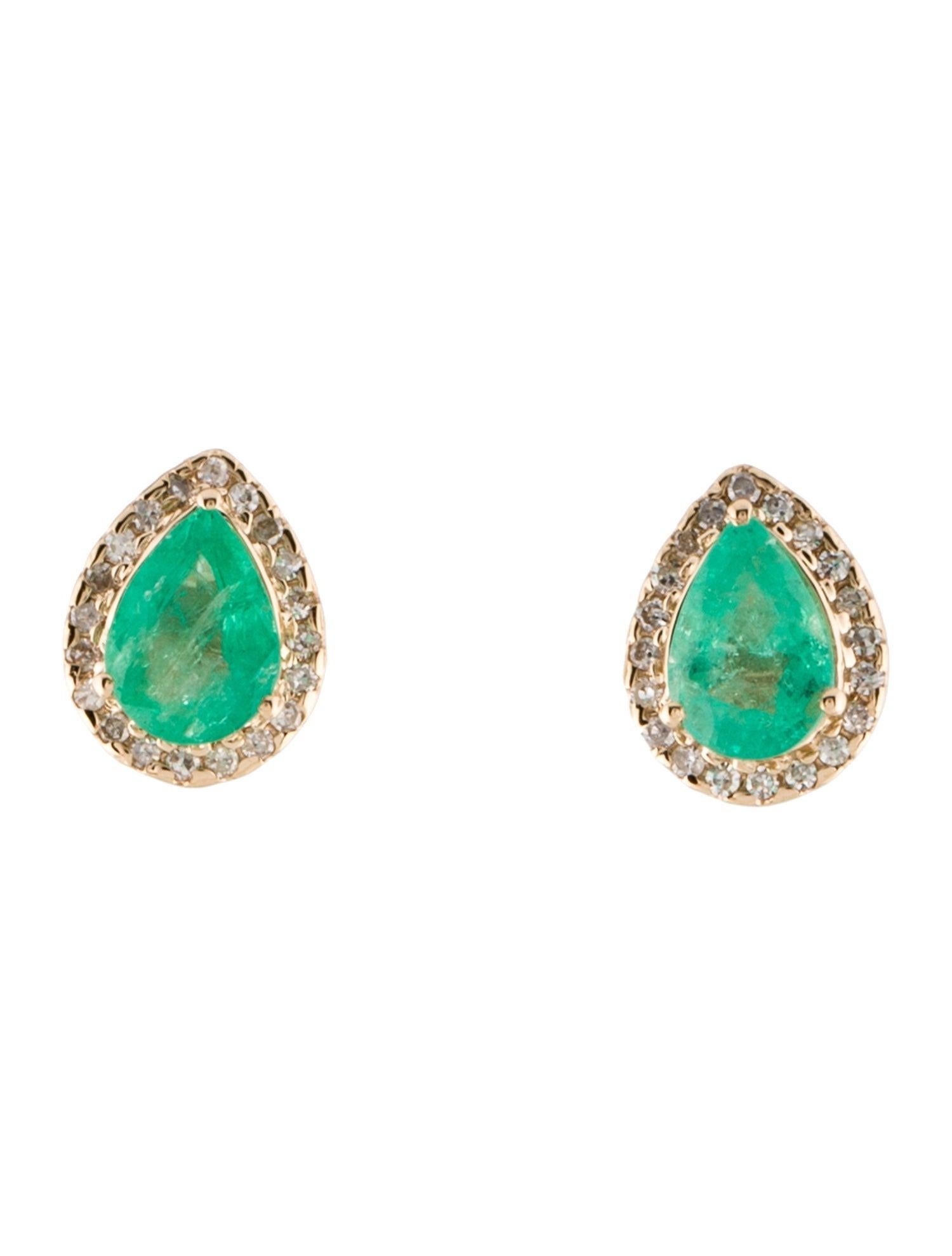 Discover the allure of these exquisite 14K Yellow Gold Stud Earrings, each featuring a stunning 1.30 carat faceted pear-shaped Emerald, complemented by a halo of forty near colorless, single-cut Diamonds totaling 0.18 carats. These earrings